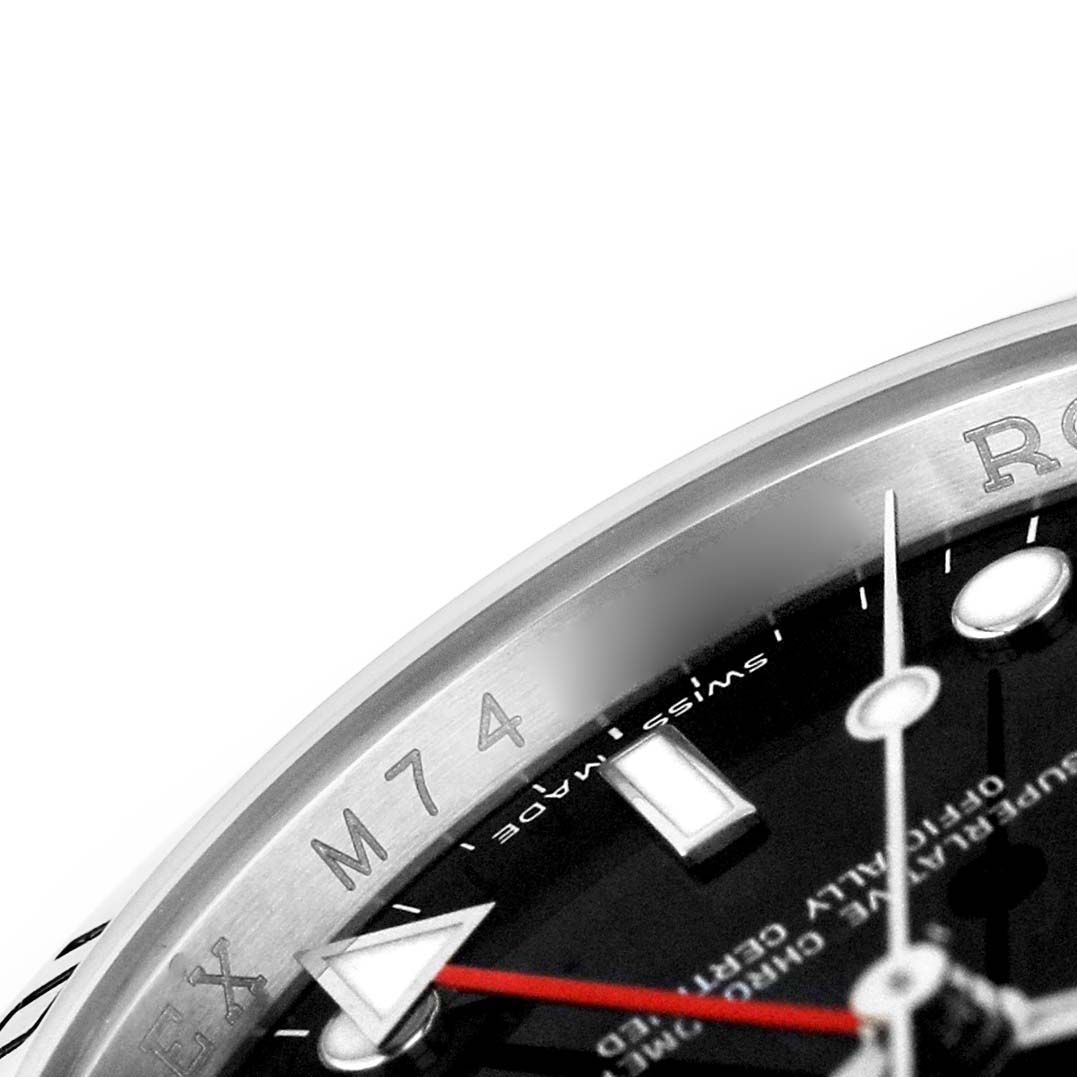 The image shows a close-up of the Rolex Explorer 16570 Men's Stainless Steel Black Dial watch, highlighting the dial, bezel, and part of the hands.