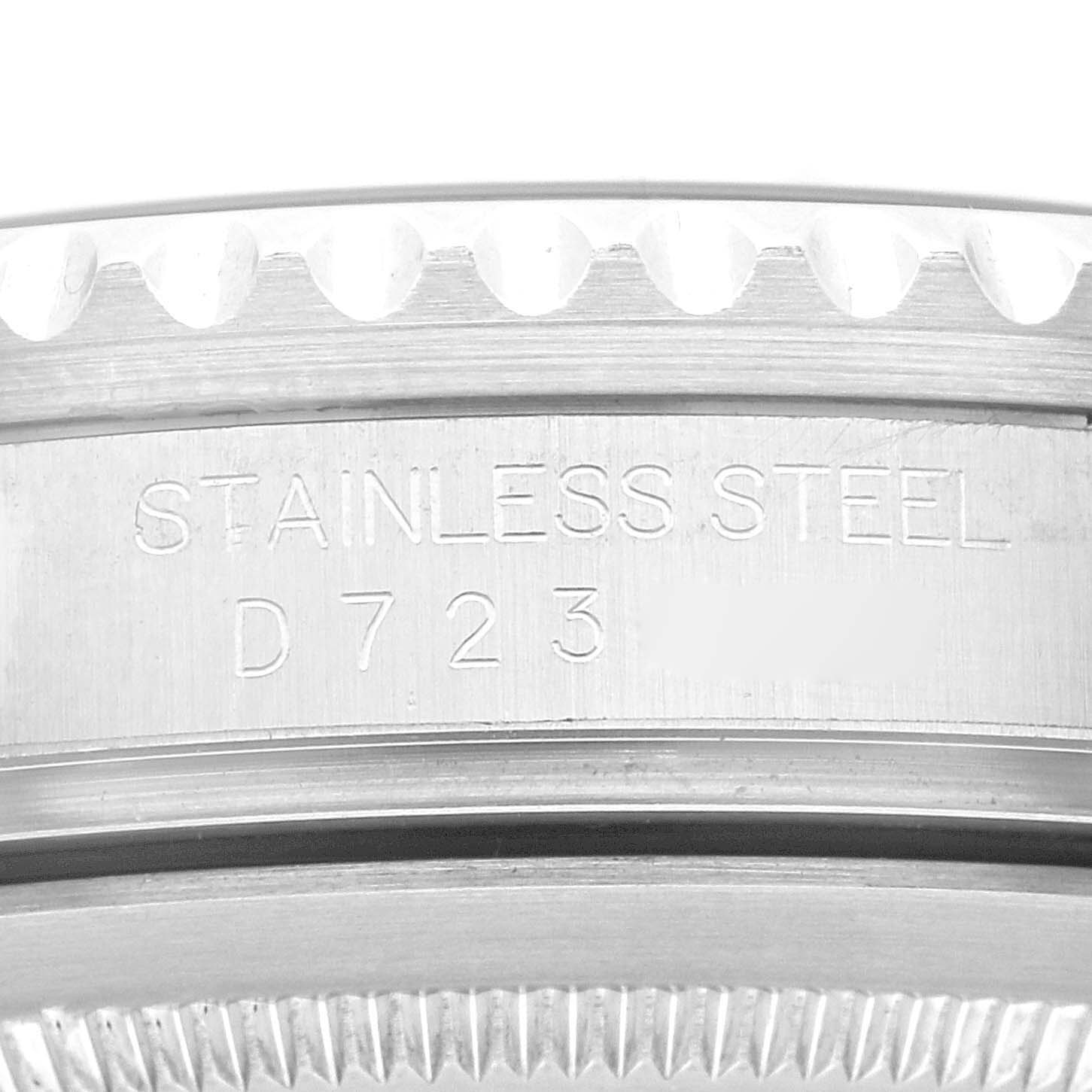 This close-up shows the engraved stainless steel casing of a Rolex GMT-Master 16710 Men's Stainless Steel Black Dial 16710 Men's Stainless Steel Black Dial watch, highlighting part of the serial number.