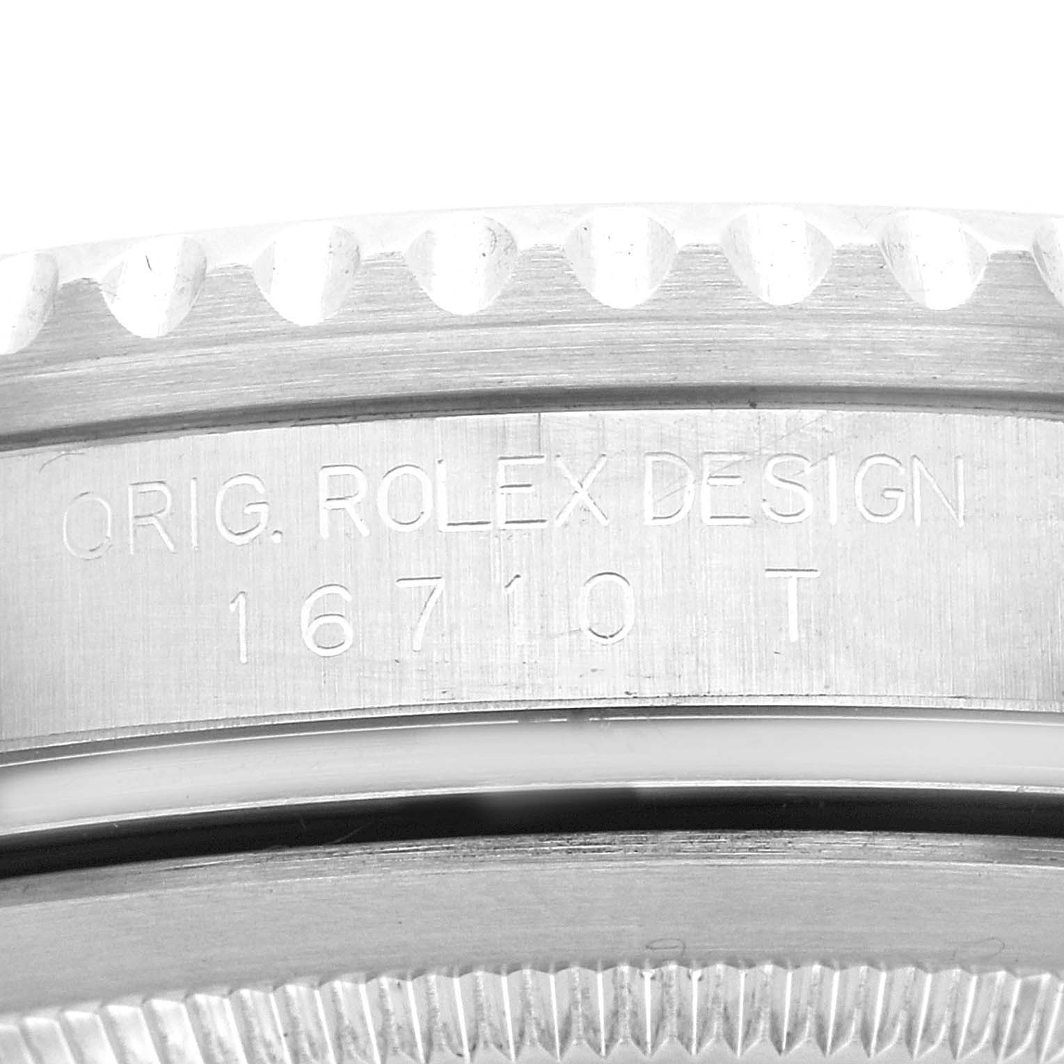 The image shows a close-up of the watch case side of a Rolex GMT-Master 16710 Men's Stainless Steel Black Dial 16710 Men's Stainless Steel Black Dial, model 16710 T, detailing the engraving.