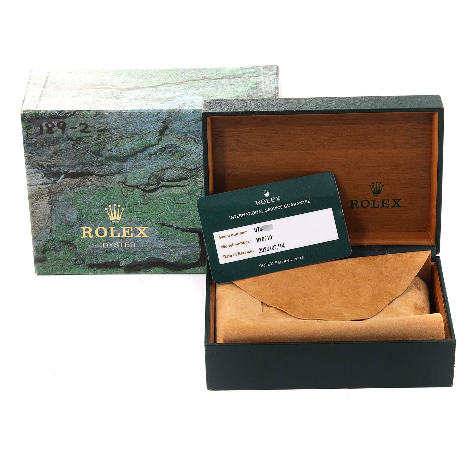 This image shows the packaging box, an empty case, and a service guarantee card for a Rolex GMT-Master 16710 Men's Stainless Steel Black Dial 16710 Men's Stainless Steel Black Dial watch.