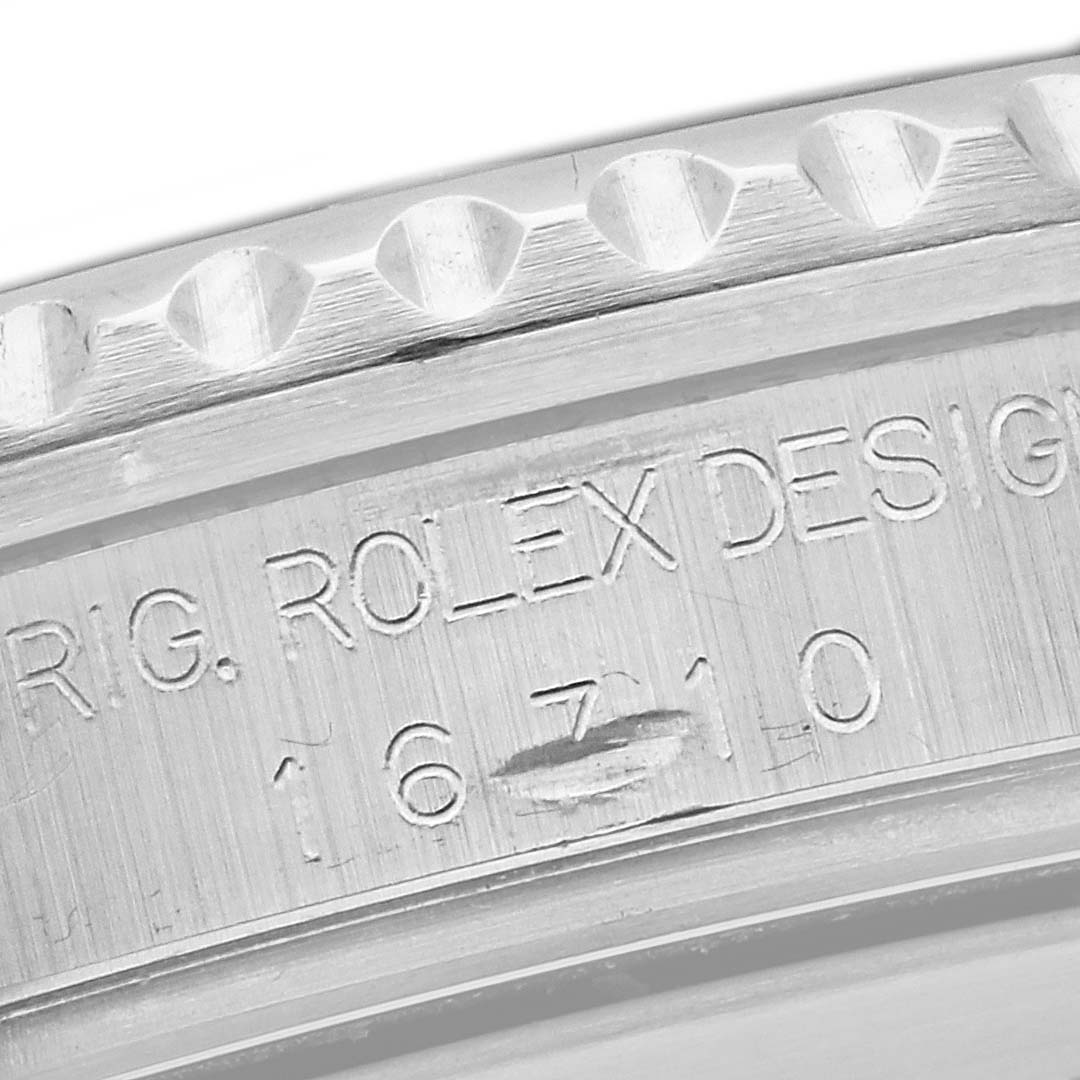 This is a close-up angle showing the model number and part of the bezel of the Rolex GMT-Master 16710 Men's Stainless Steel Black Dial 16710 Men's Stainless Steel Black Dial.