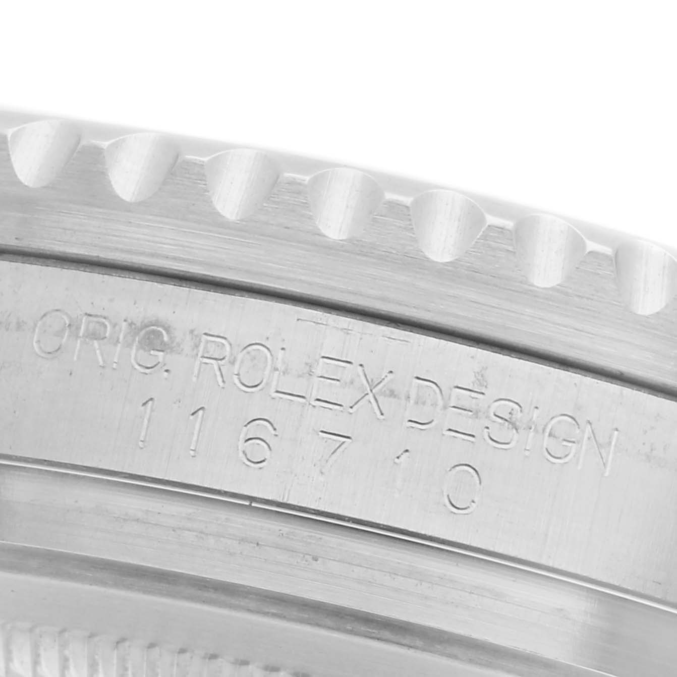 The image shows the side engraving on the case of a Rolex GMT-Master 116710 Men
s Stainless Steel Black Dial 116710 Men
s Stainless Steel Black Dial, model number 116710.