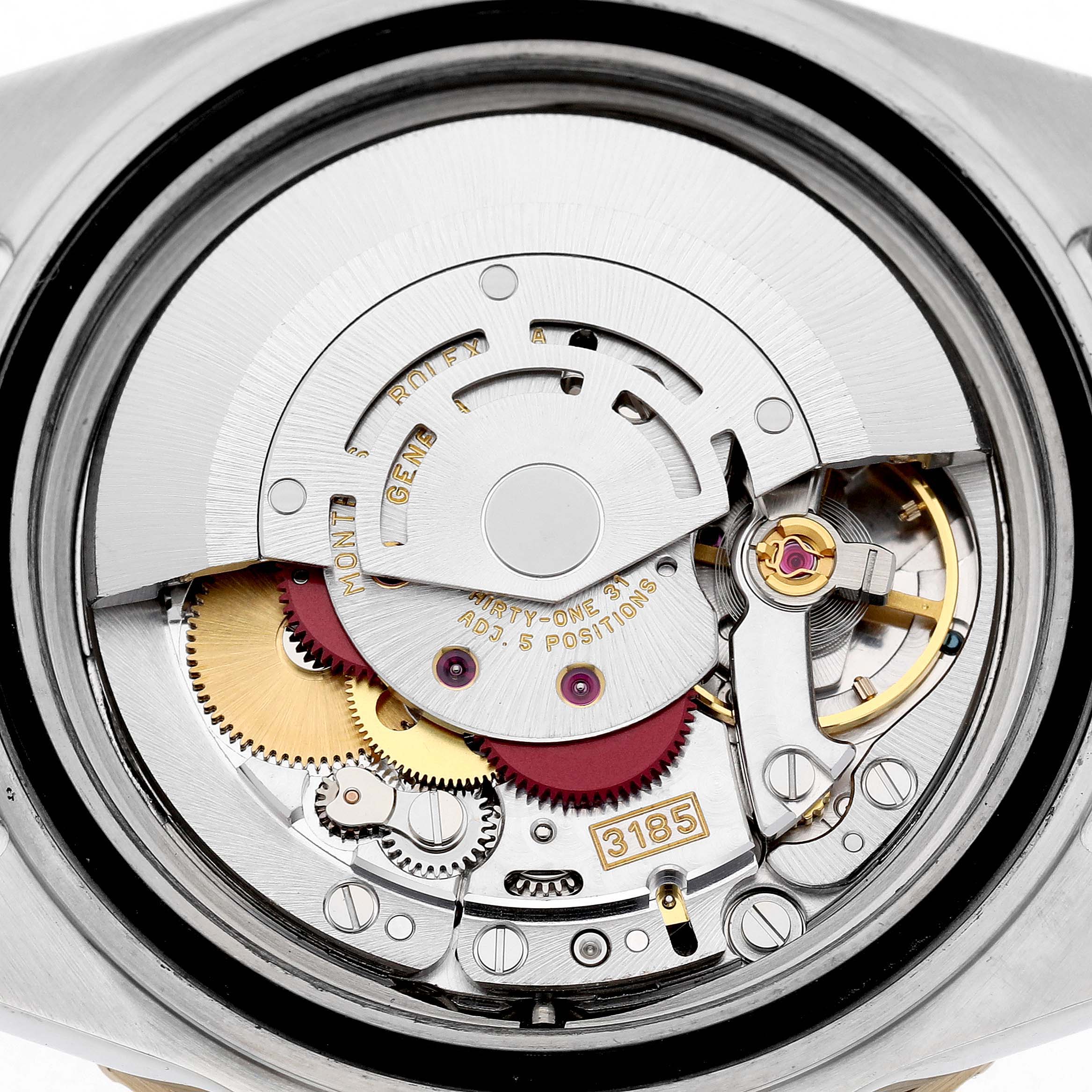 The image shows the internal mechanism of a Rolex GMT-Master 16713LN Men's Stainless Steel Black Dial, highlighting the intricate gears and movement components.