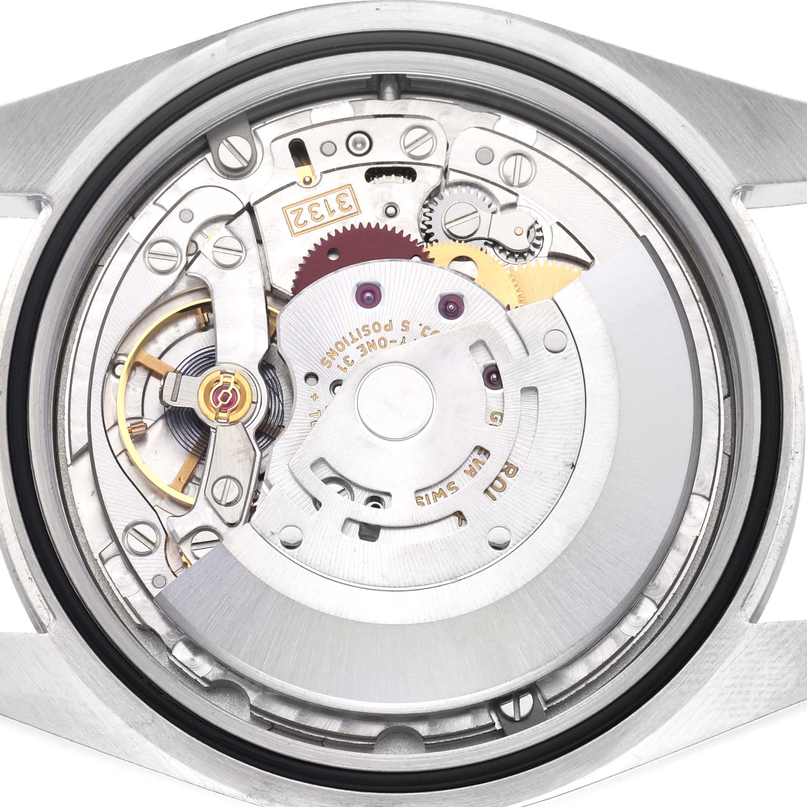 The image shows the back view of a Rolex Oyster Perpetual 114300 Men
s Stainless Steel Blue Dial 114300 Men
s Stainless Steel Blue Dial, highlighting its intricate movement and internal components.