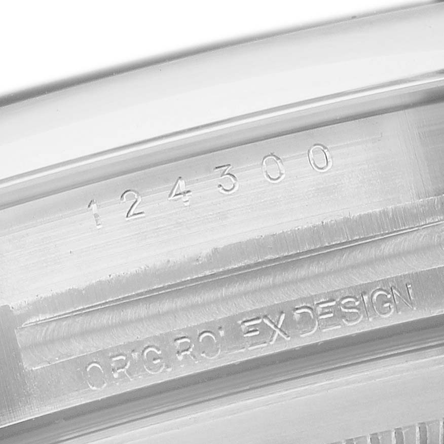 This image shows a close-up of the serial number and model engraving on the case side of the Rolex Oyster Perpetual 124300 Men's Stainless Steel Black Dial watch.