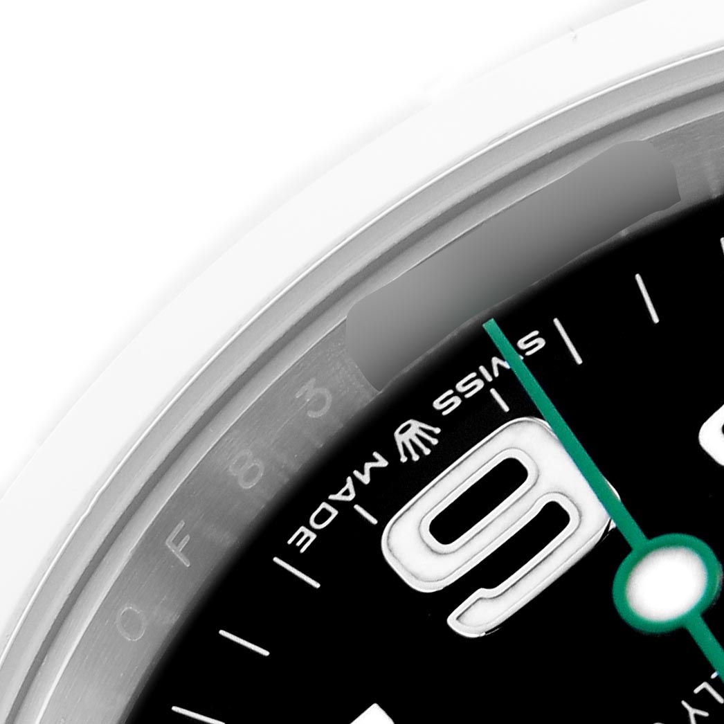 The image shows a close-up of the Rolex Air-King 126900 Men's Stainless Steel Black Dial 126900 Men's Stainless Steel Black Dial's dial and bezel, focusing on the "9" and part of the "Swiss Made" text.