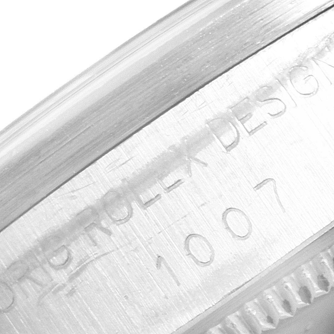 This image shows a close-up view of the engraved side of the case of a Vintage Collection Rolex watch.