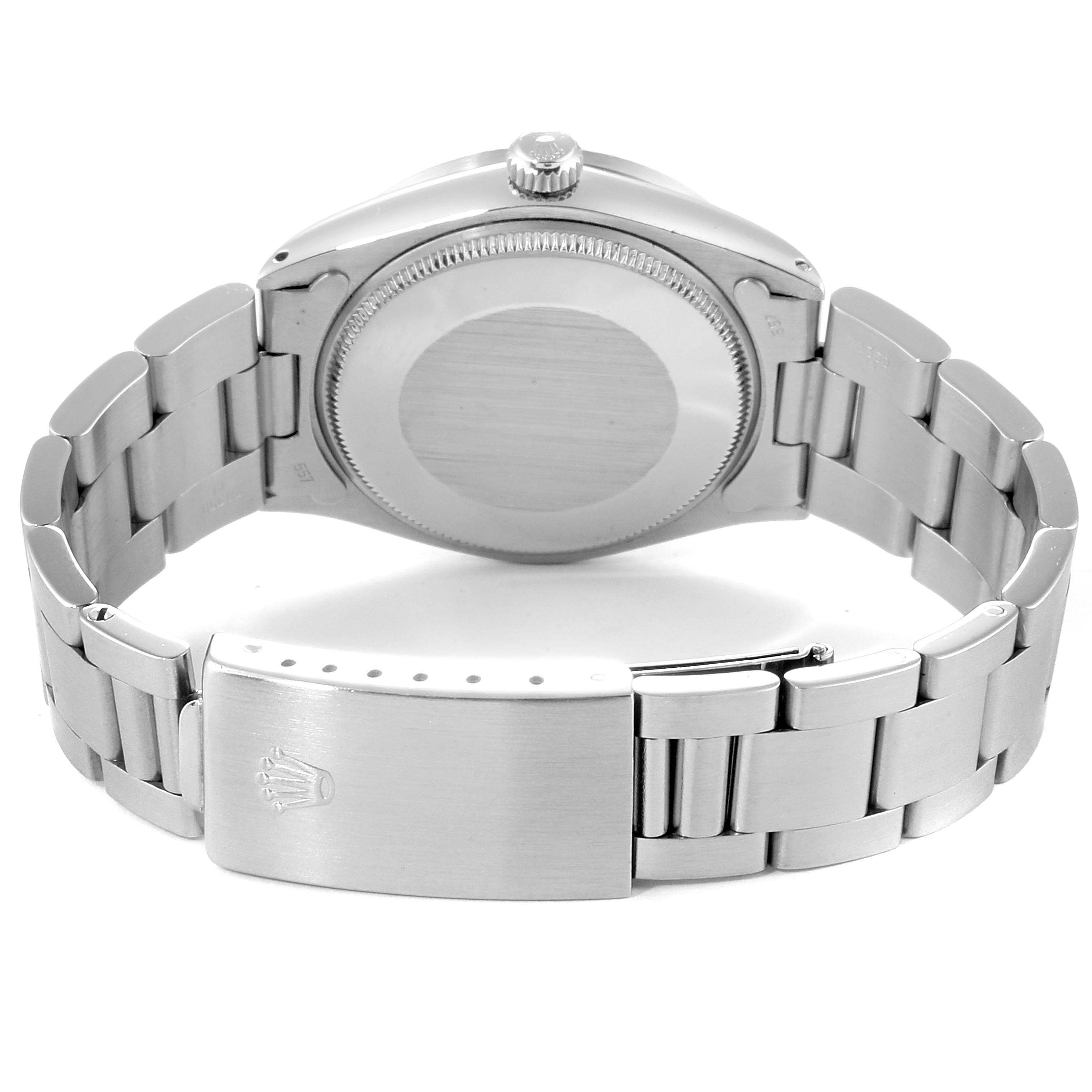 The image shows the back case and bracelet of a Vintage Collection model by Rolex, including the clasp with the brand logo.