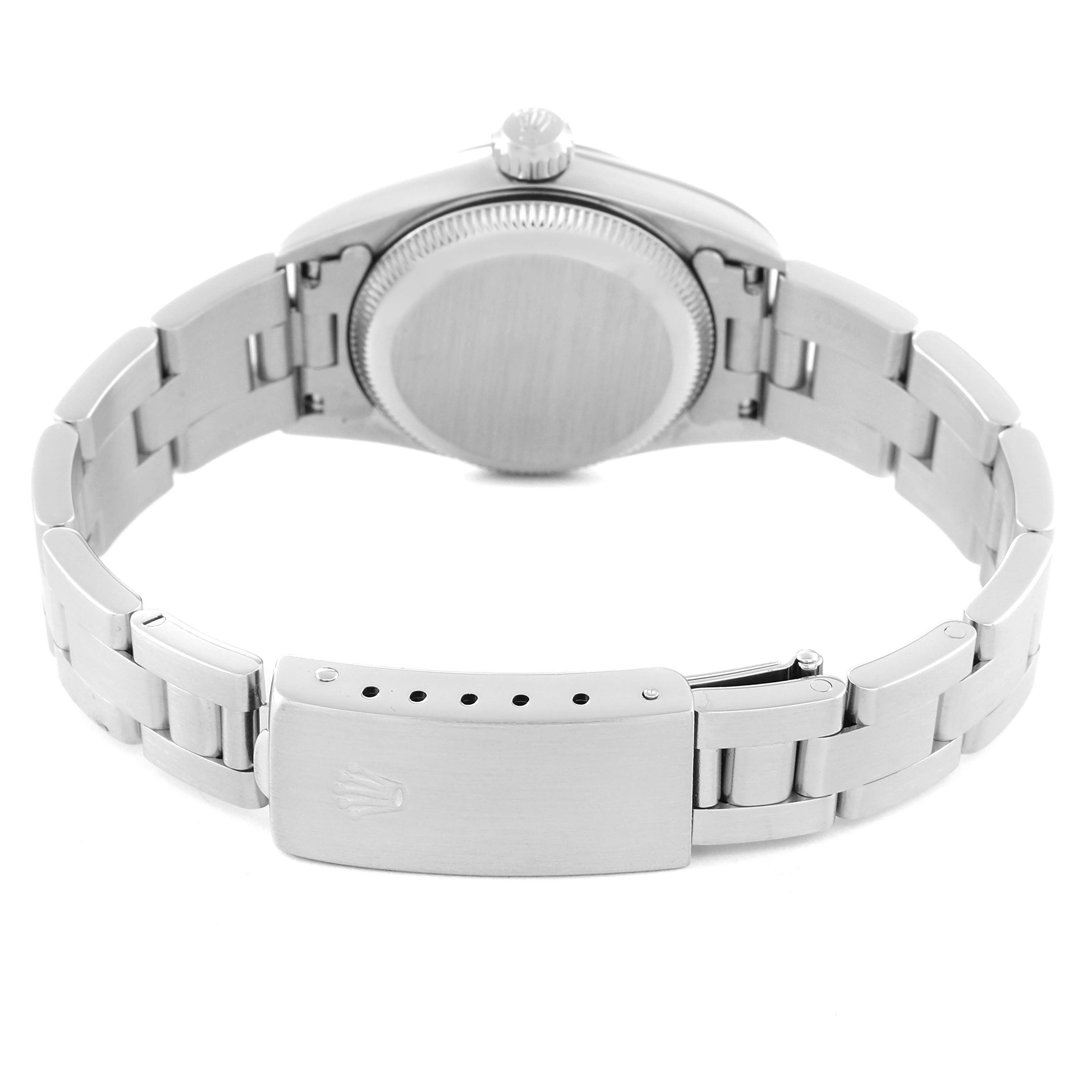 This image shows the back of a Rolex Oyster Perpetual 67180 Women's Stainless Steel Black Dial 67180 Women's Stainless Steel Black Dial watch with an emphasis on the bracelet clasp and case back.