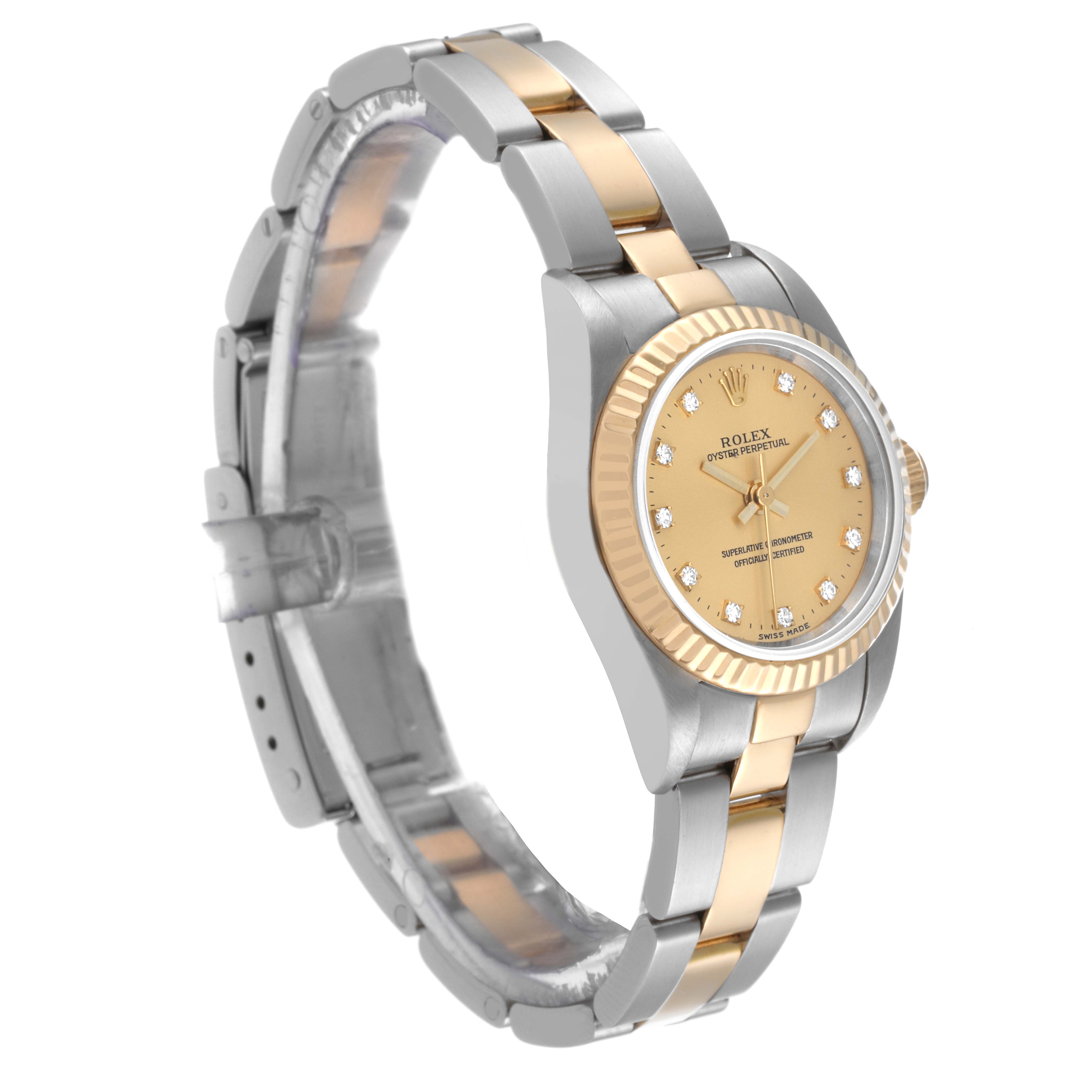 This image shows a side-angle view of the Rolex Oyster Perpetual 76193 Women's Steel and Gold (two tone) Champagne Dial 76193 Women's Steel and Gold (two tone) Champagne Dial watch, highlighting its gold dial, bezel, and two-tone bracelet.