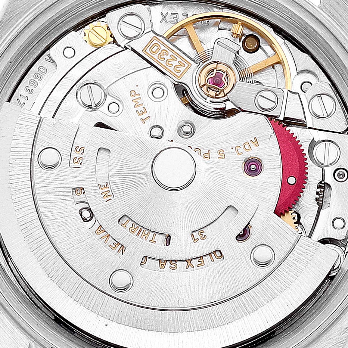 This image shows the intricate internal mechanisms of the Rolex Oyster Perpetual 76193 Women's Steel and Gold (two tone) Champagne Dial 76193 Women's Steel and Gold (two tone) Champagne Dial watch from a top-down angle.