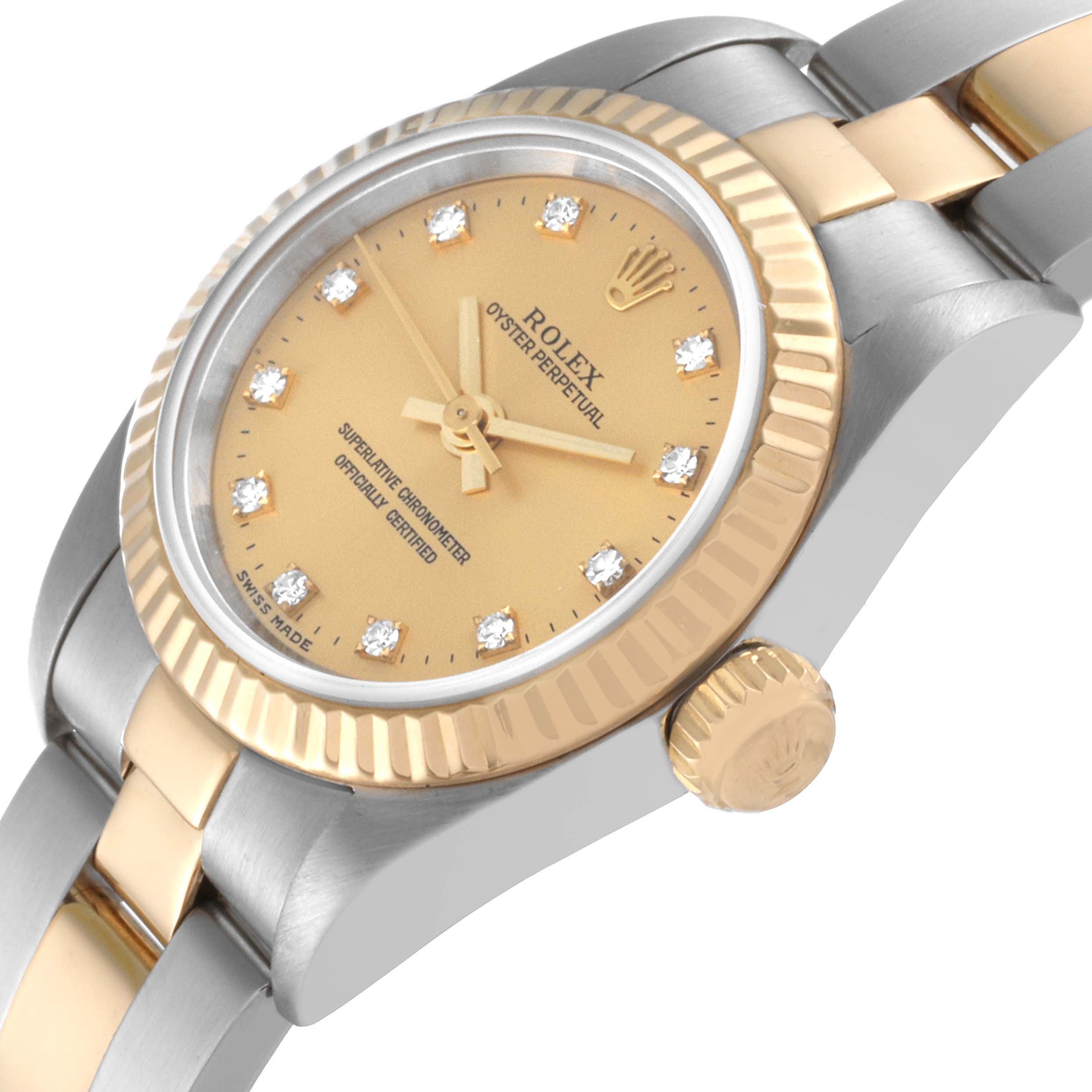 The image shows a close-up angle of a Rolex Oyster Perpetual 76193 Women's Steel and Gold (two tone) Champagne Dial 76193 Women's Steel and Gold (two tone) Champagne Dial watch, highlighting the dial, bezel, crown, and part of the bracelet.