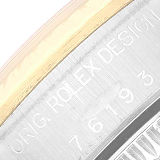 This image shows a close-up of the case back engraving on a Rolex Oyster Perpetual 76193 Women's Steel and Gold (two tone) Champagne Dial 76193 Women's Steel and Gold (two tone) Champagne Dial watch.