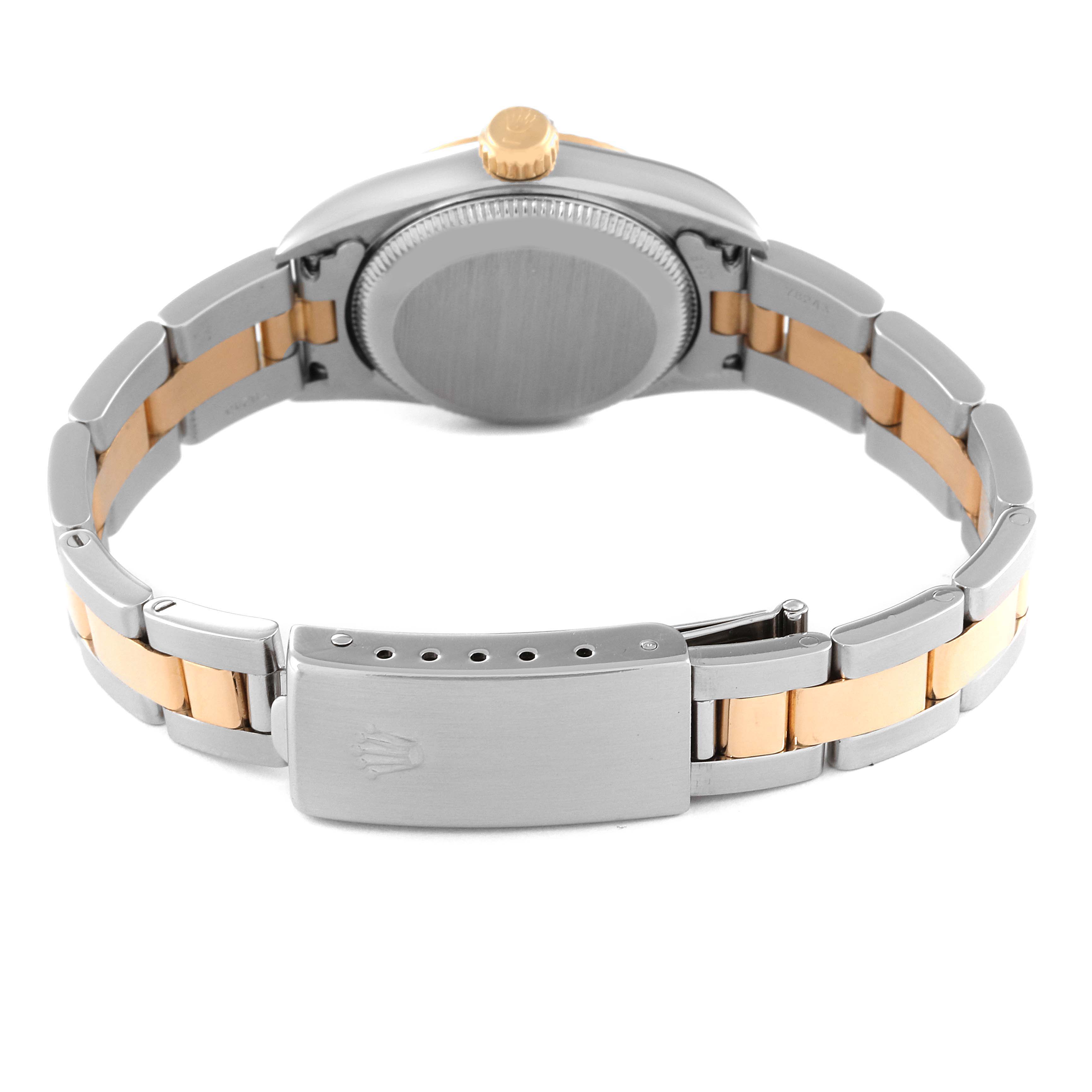 This image shows the back and bracelet of the Rolex Oyster Perpetual 76193 Women's Steel and Gold (two tone) Champagne Dial 76193 Women's Steel and Gold (two tone) Champagne Dial watch from a horizontal angle.