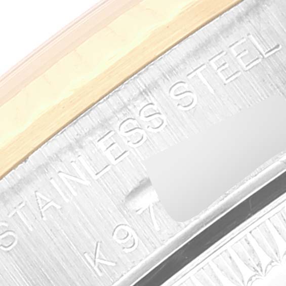 This image shows a close-up angle of the engraving on the side of the Rolex Oyster Perpetual 76193 Women's Steel and Gold (two tone) Champagne Dial 76193 Women's Steel and Gold (two tone) Champagne Dial watch case.