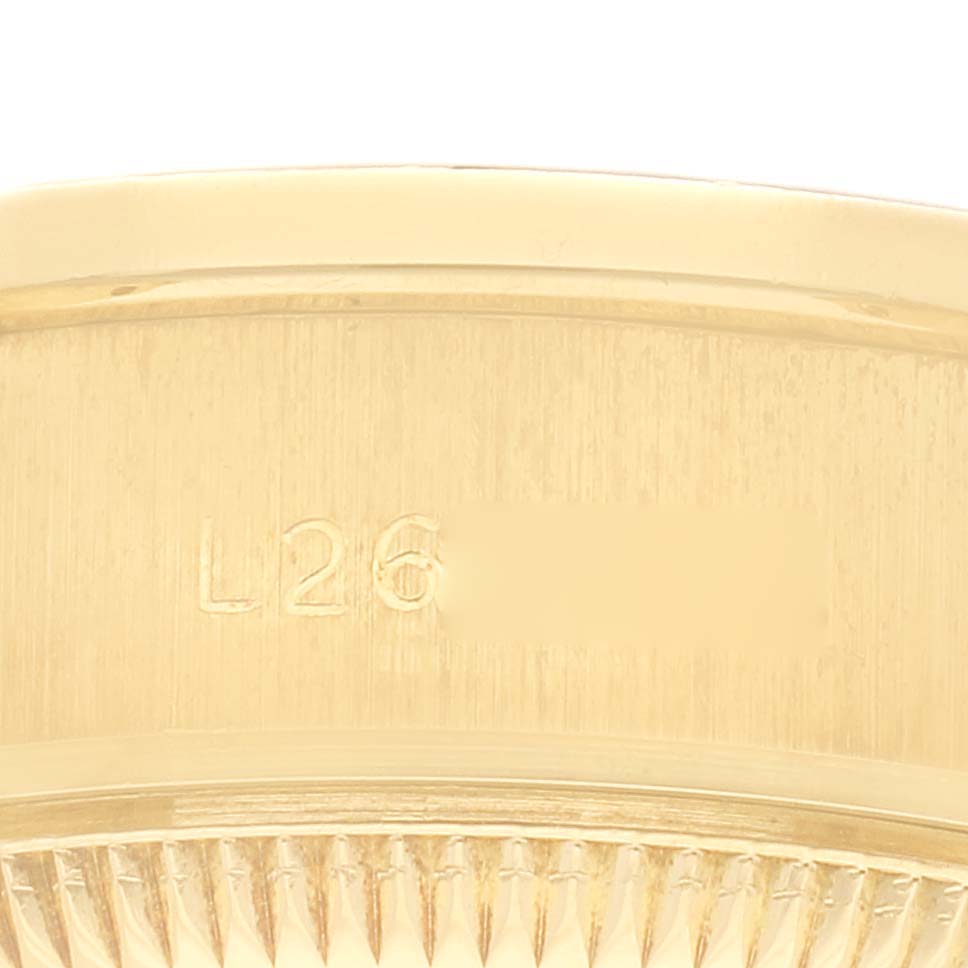 The image shows a close-up of the stamped serial number on the side of the Rolex President 69068 Women
s Yellow Gold Champagne Dial 69068 Women
s Yellow Gold Champagne Dial watch case.