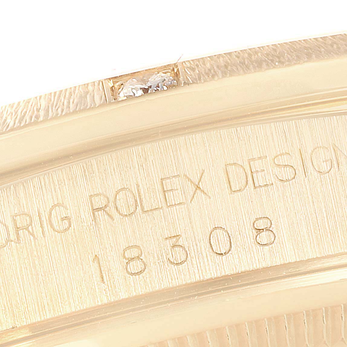 The image shows a close-up of the President Rolex model's case, highlighting the engraved serial number and "Orig Rolex Design."