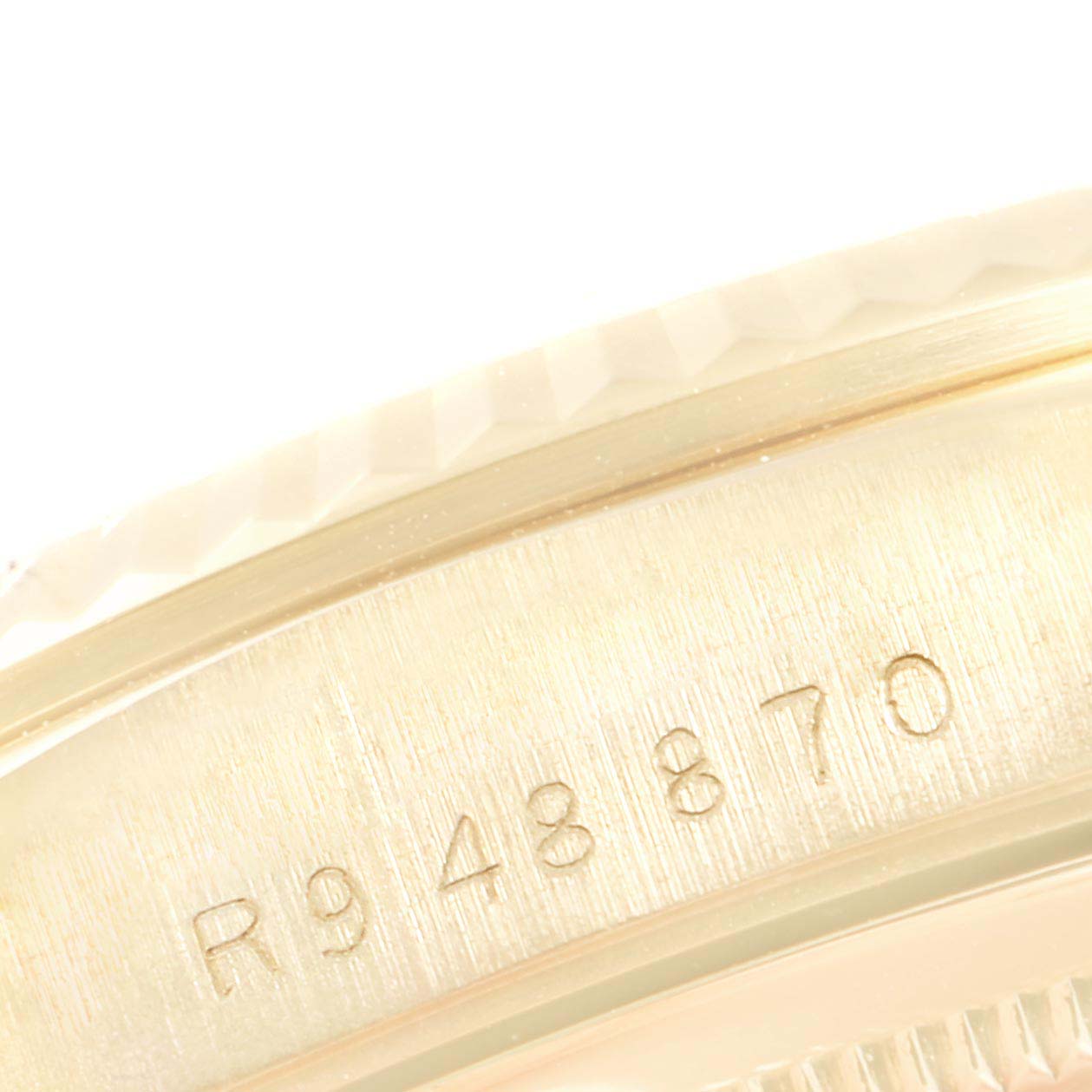 This image shows the side of the bezel and serial number of the Rolex President 18238 Men's Yellow Gold Black Dial 18238 Men's Yellow Gold Black Dial watch.