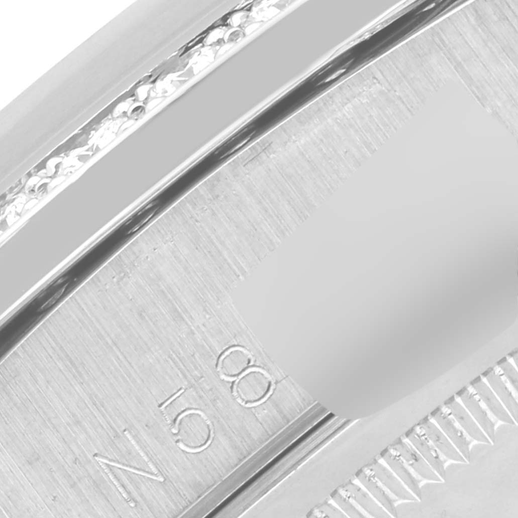 This close-up image shows a portion of the bezel and the inner markings of a Rolex President 18389G Men's White Gold Silver Dial 18389G Men's White Gold Silver Dial watch.