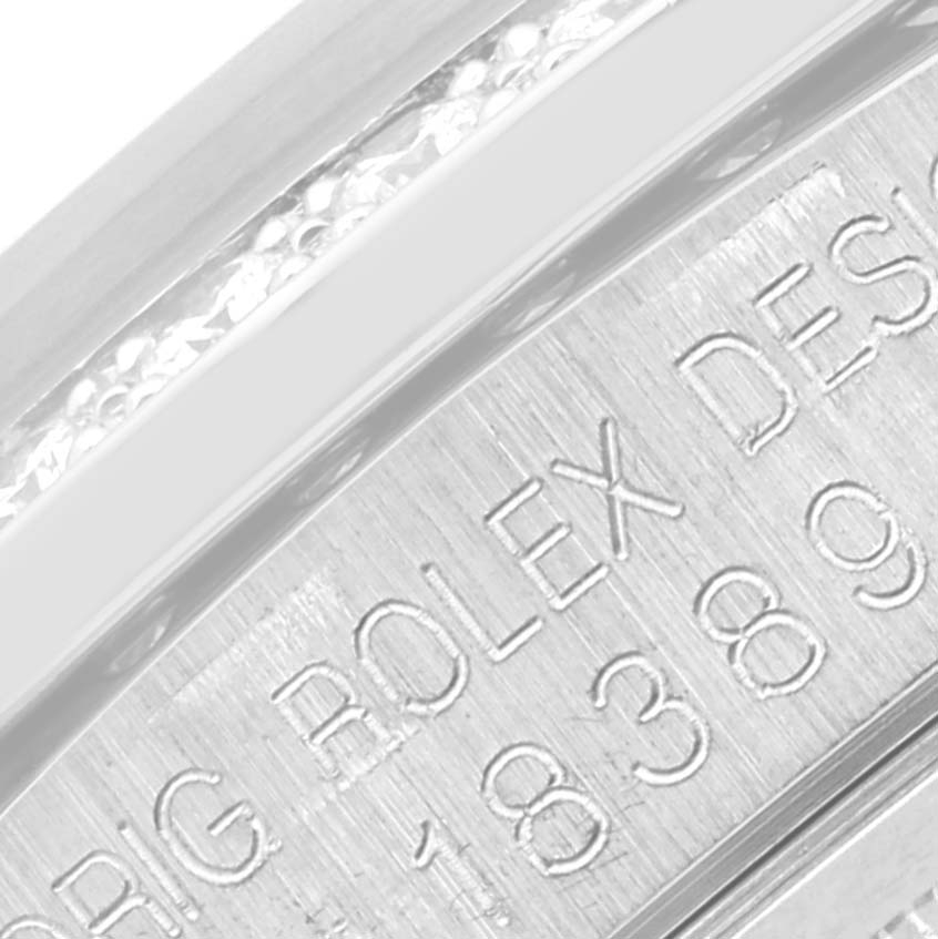 This image shows a close-up of the engraved inner bezel on a Rolex President 18389G Men's White Gold Silver Dial 18389G Men's White Gold Silver Dial model.