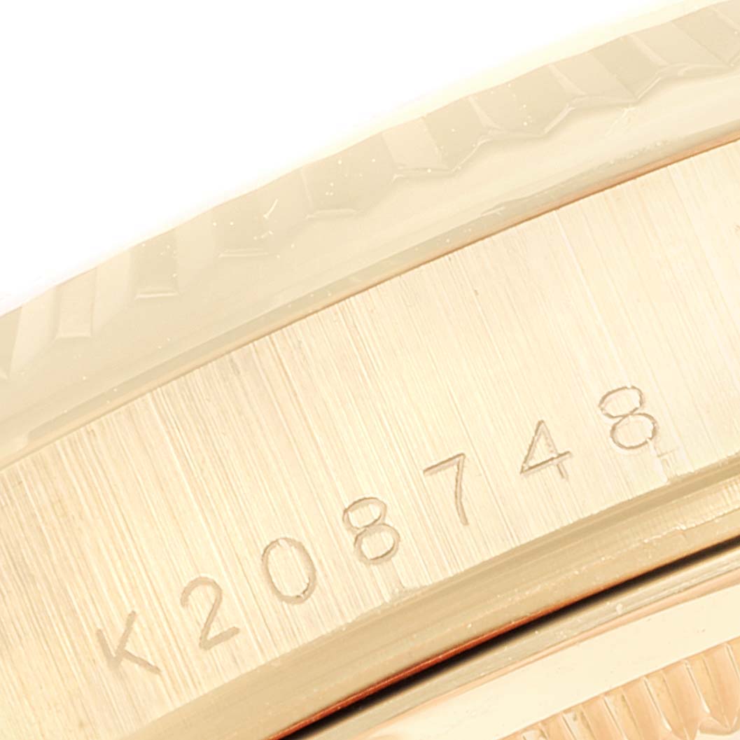 The close-up image shows the serial number engraving on the case side of the Rolex President 118238 Men
s Yellow Gold Black Dial 118238 Men
s Yellow Gold Black Dial model.