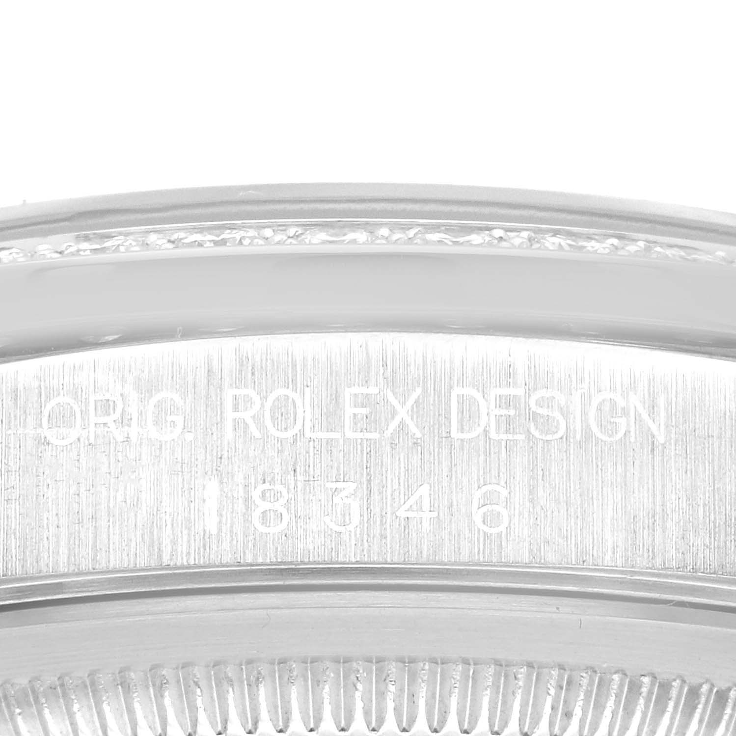 This close-up image shows the engraved case back of a Rolex President 18346 Men's Platinum Silver Dial 18346 Men's Platinum Silver Dial model watch.