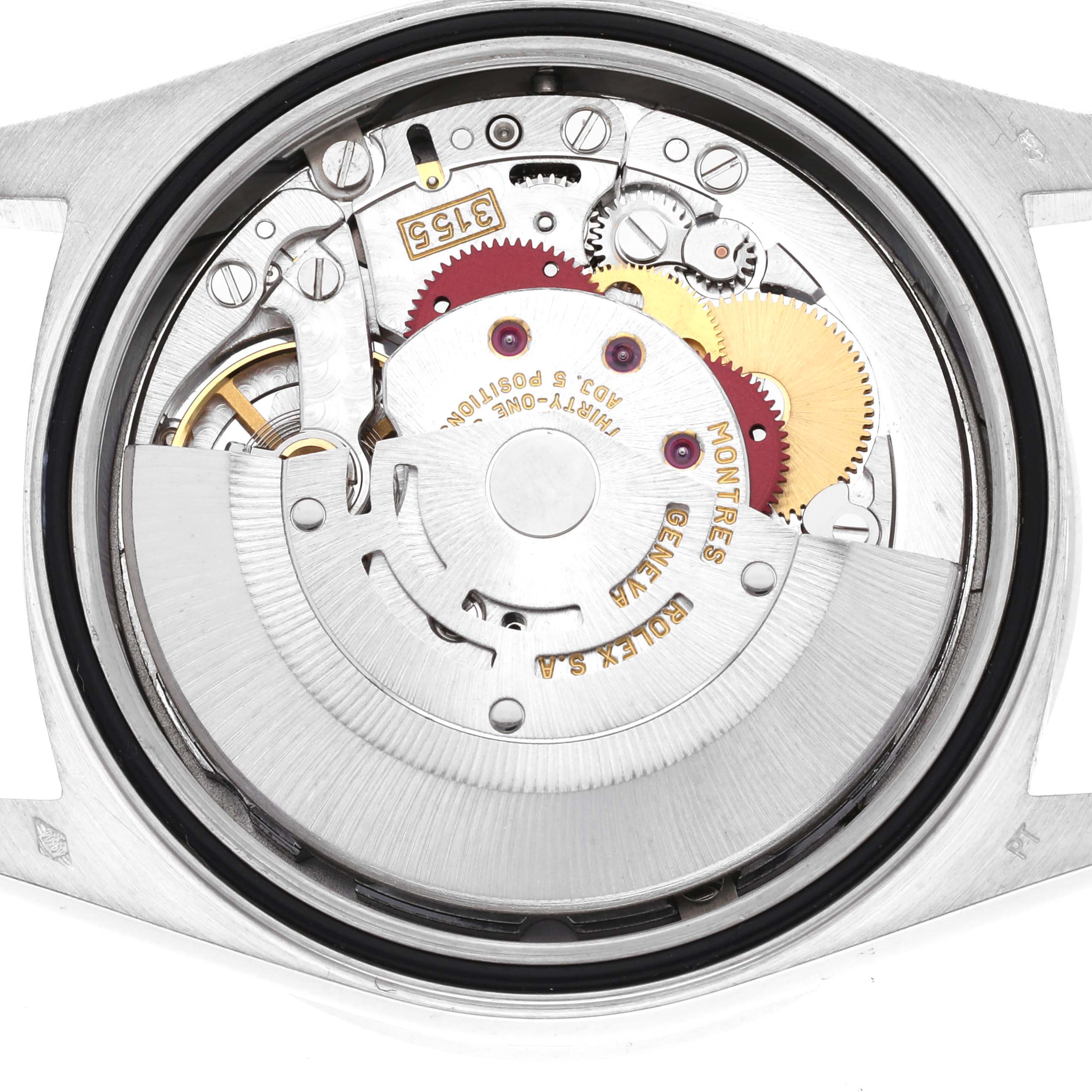 This is the internal mechanism of a Rolex President 18346 Men's Platinum Silver Dial 18346 Men's Platinum Silver Dial model watch, shown from the back, displaying gears and rotor components.