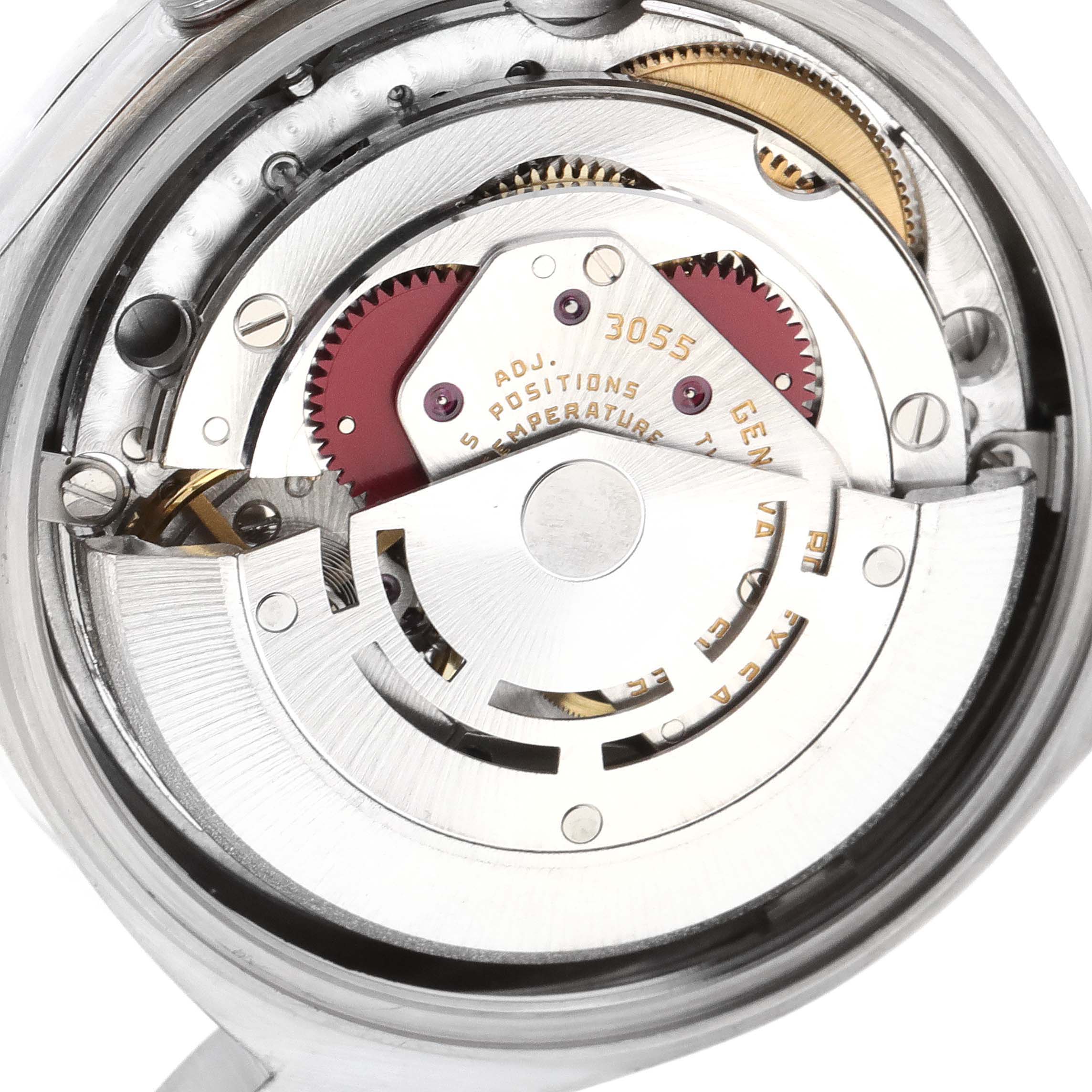 This image shows the internal mechanism of a Rolex President 18049 Men
s White Gold Silver Dial 18049 Men
s White Gold Silver Dial model watch, highlighting its intricate gears and movement parts.
