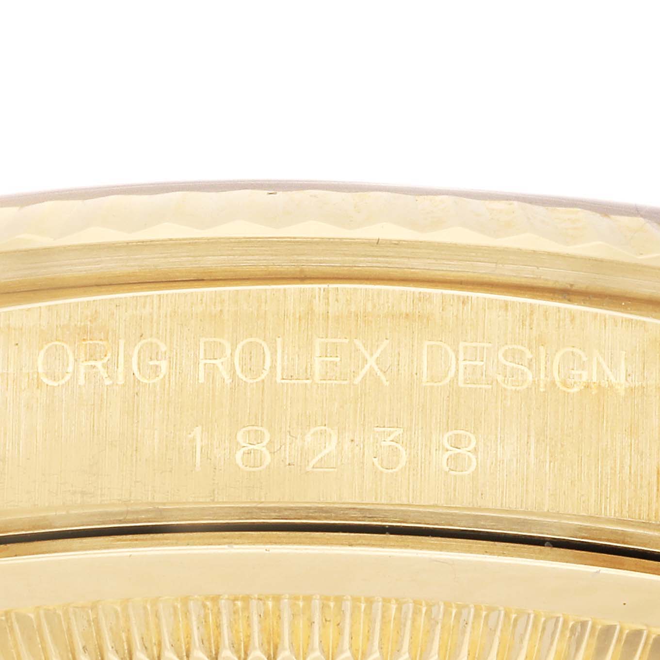 The image shows the side of a gold Rolex President 18238 Men's Yellow Gold Champagne Dial model watch case with "ORIG ROLEX DESIGN" and the model number engraved.