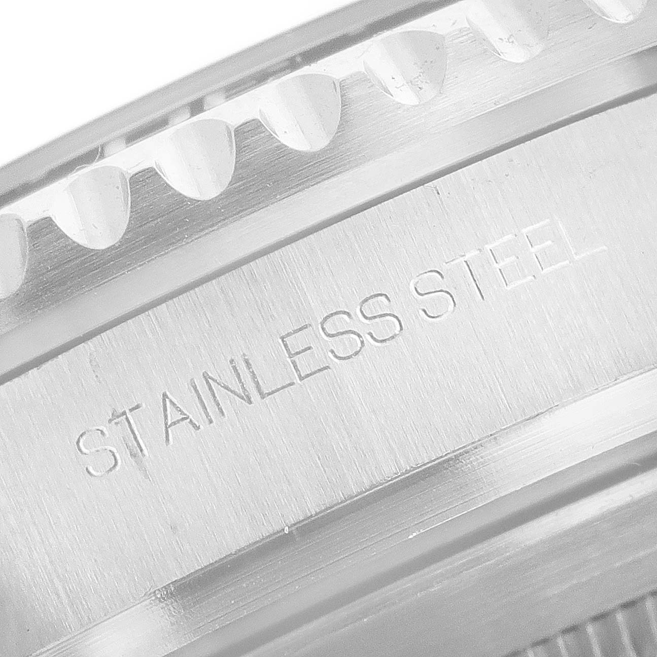 This close-up image shows the stainless steel case of a Rolex Sea-Dweller 126600 Men
s Stainless Steel Black Dial 126600 Men
s Stainless Steel Black Dial watch, focusing on the side engravings and edge detail.