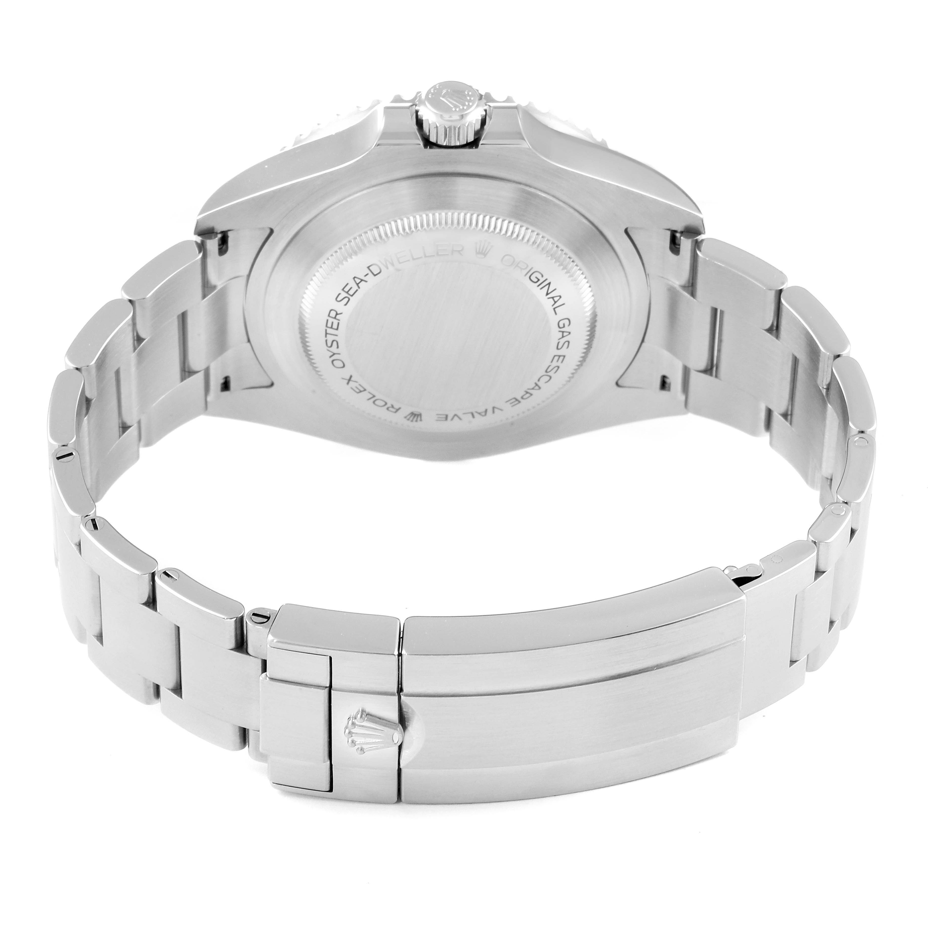 The image shows the back of a Rolex Sea-Dweller 126600 Men
s Stainless Steel Black Dial 126600 Men
s Stainless Steel Black Dial watch and its metal bracelet, including the clasp and case back.