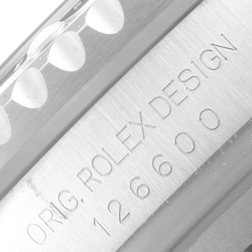 This close-up image shows the engraved side of the bezel and case of the Rolex Sea-Dweller 126600 Men
s Stainless Steel Black Dial 126600 Men
s Stainless Steel Black Dial model.