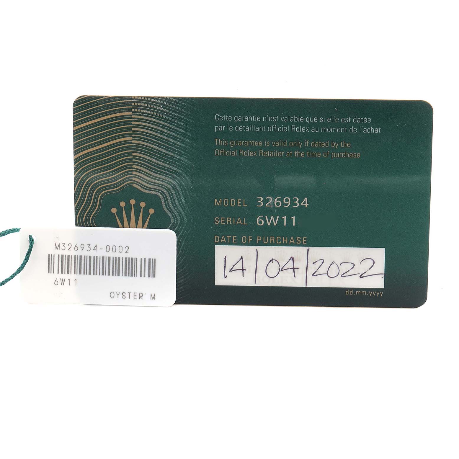 The image shows the warranty card and tag for a Rolex Sky-Dweller 326934 Men
s Stainless Steel Silver Dial 326934 Men
s Stainless Steel Silver Dial, displaying model and serial numbers along with the purchase date.