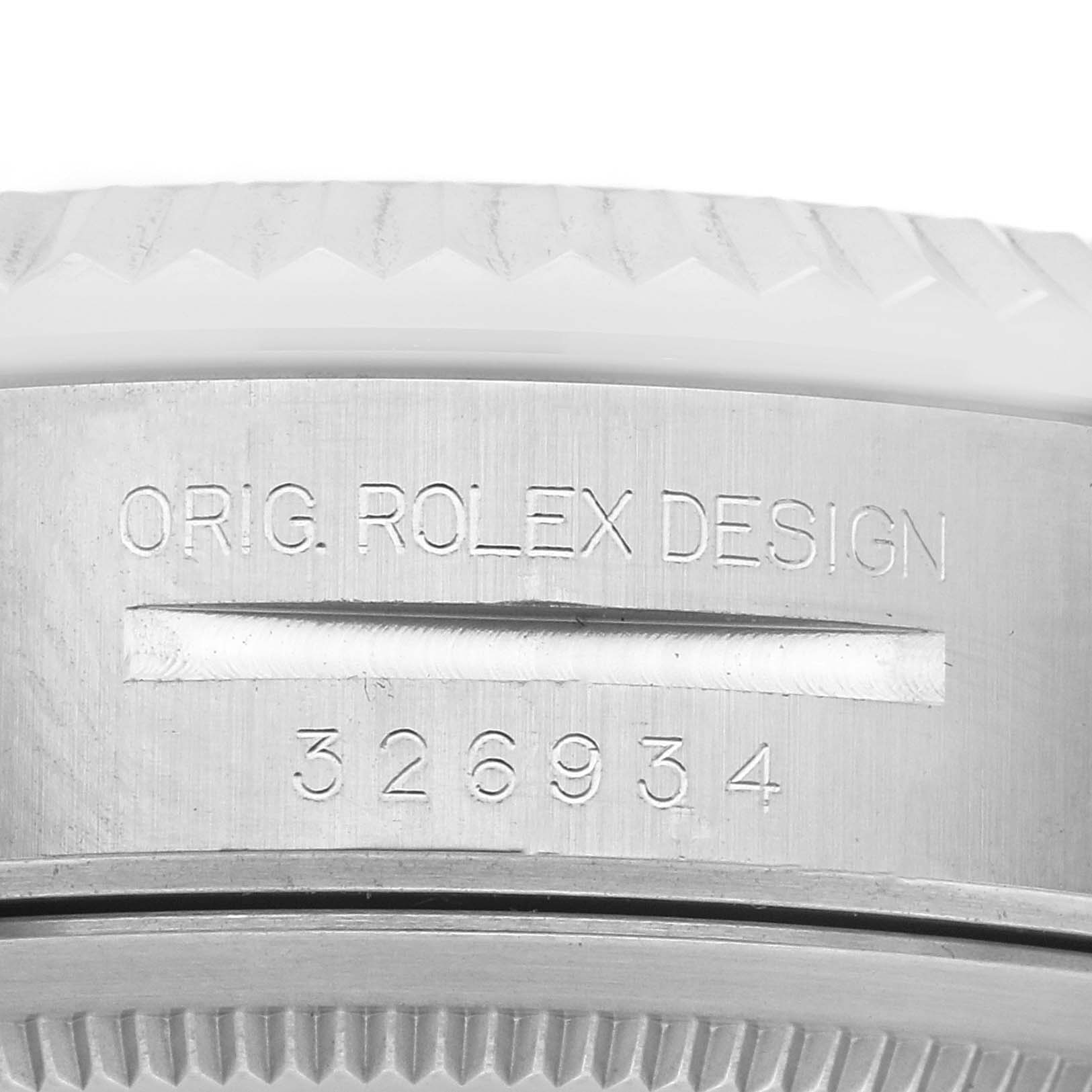 The image shows a close-up of the case side of a Rolex Sky-Dweller 326934 Men
s Stainless Steel Silver Dial 326934 Men
s Stainless Steel Silver Dial, highlighting the model number and design engraving.