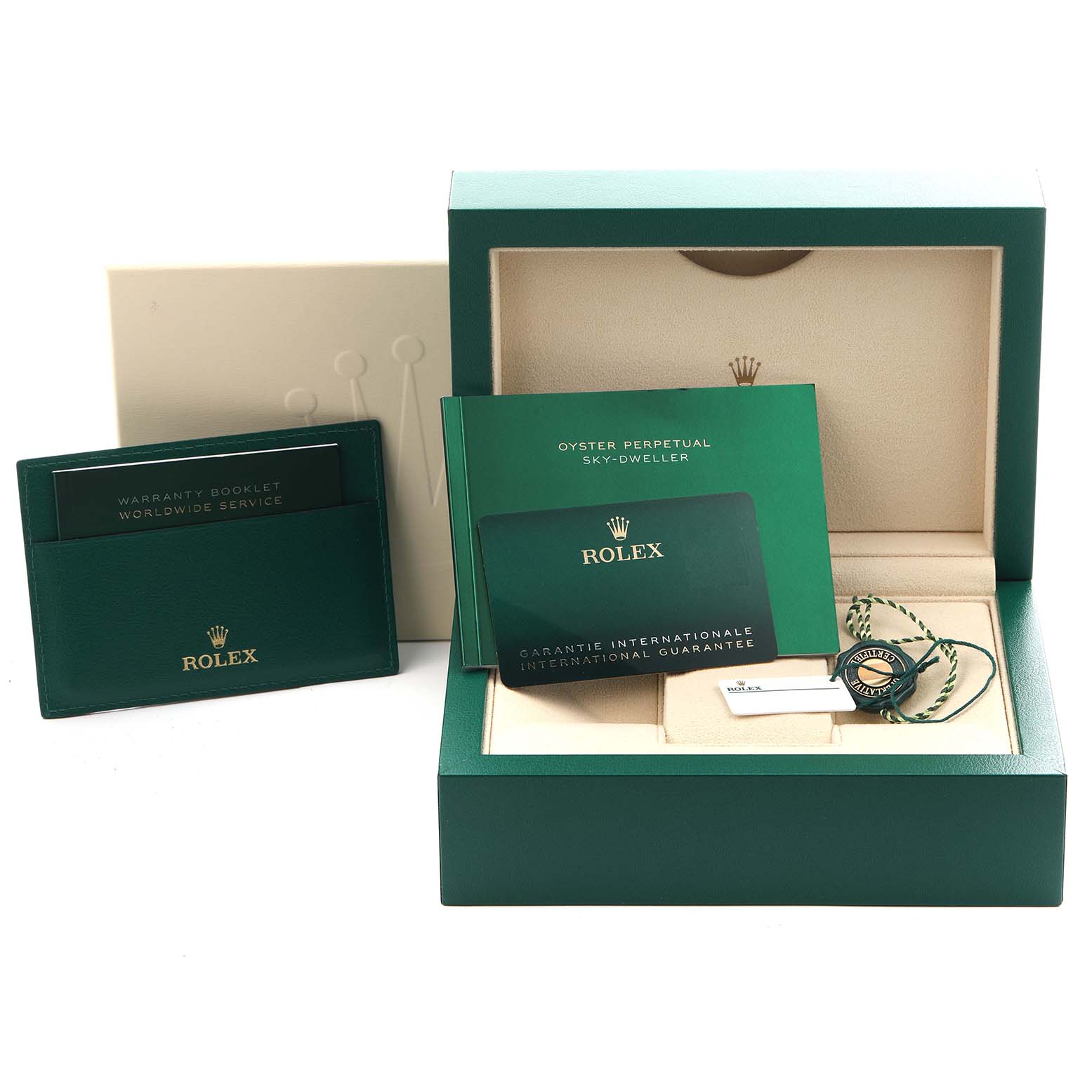 The image shows the packaging and accessories for a Rolex Sky-Dweller 326934 Men
s Stainless Steel Silver Dial 326934 Men
s Stainless Steel Silver Dial, including booklets, a warranty card, and a box.