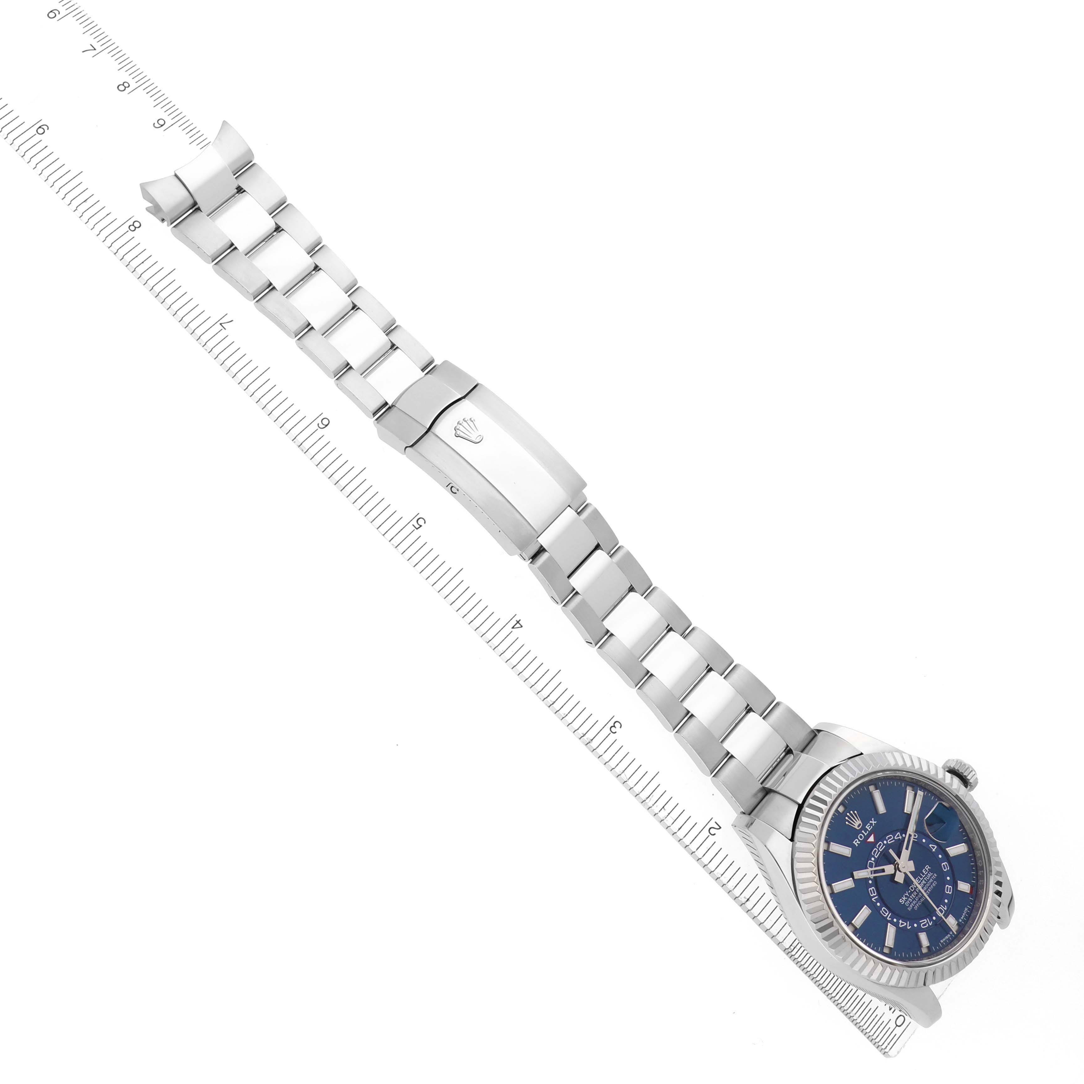 The Rolex Sky-Dweller 336934 Men
s Stainless Steel Blue Dial 336934 Men
s Stainless Steel Blue Dial is shown at an oblique angle with its bracelet extended, revealing the clasp and a partial view of the dial.