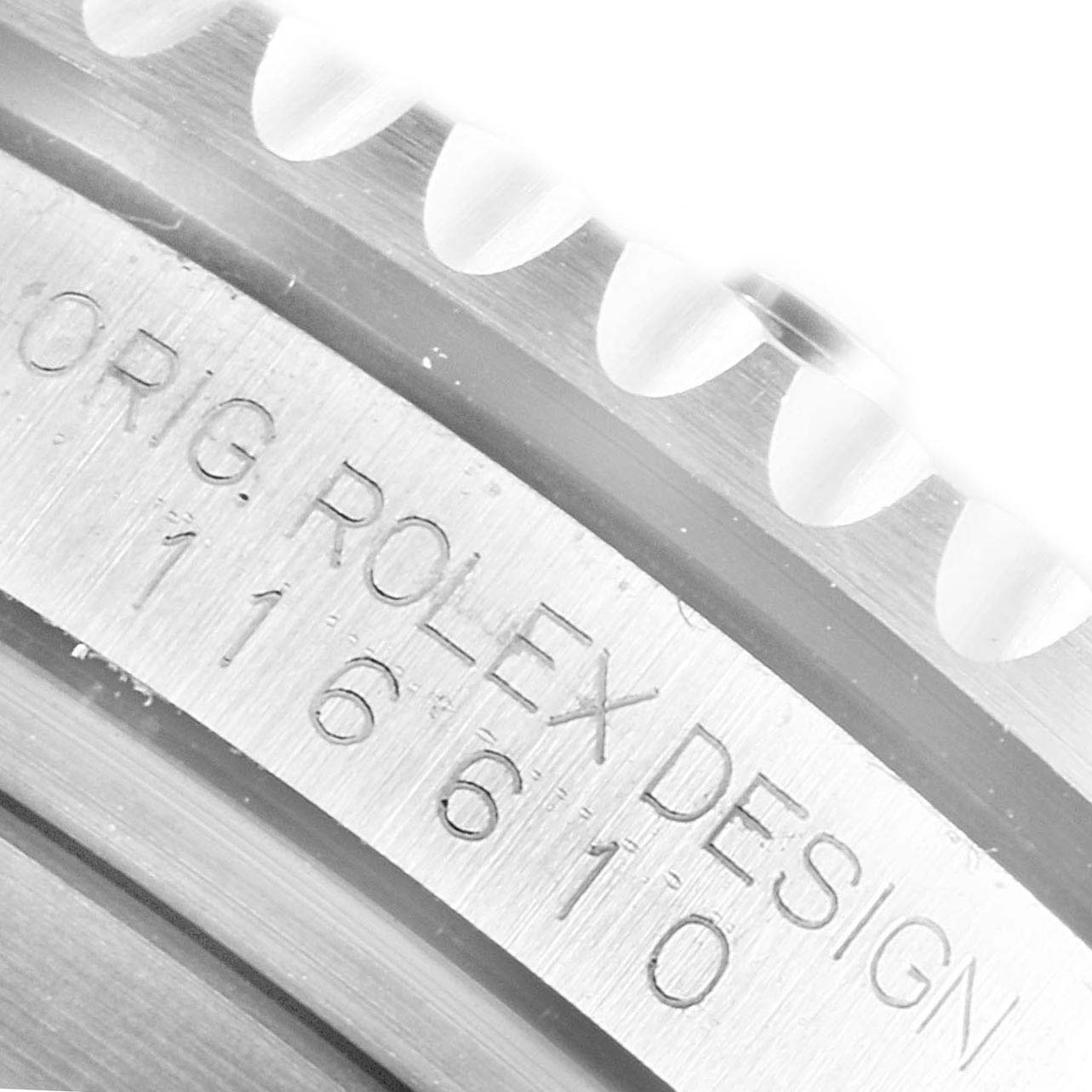 The image shows a close-up of the bezel and engraved case of a Rolex Submariner 116610 Men
s Stainless Steel Black Dial 116610 Men
s Stainless Steel Black Dial watch.