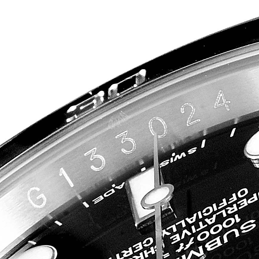 This image shows a close-up of the serial number and part of the dial of a Rolex Submariner 116610 Men
s Stainless Steel Black Dial 116610 Men
s Stainless Steel Black Dial watch.