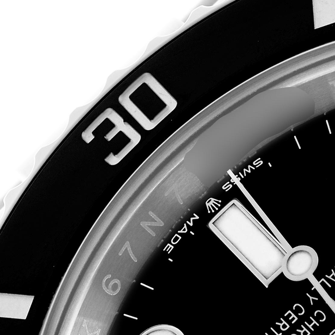 The image shows a close-up of the bezel and part of the dial of a Rolex Submariner 126610 Men
s Stainless Steel Black Dial 126610 Men
s Stainless Steel Black Dial, focusing on the "30" mark.