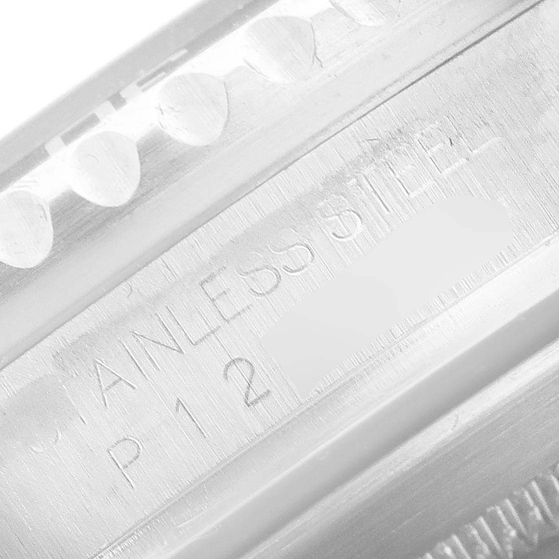 The image shows a close-up of the inner bezel and the stainless steel engraving on the Rolex Submariner 16610 Men
s Stainless Steel Black Dial 16610 Men
s Stainless Steel Black Dial model.