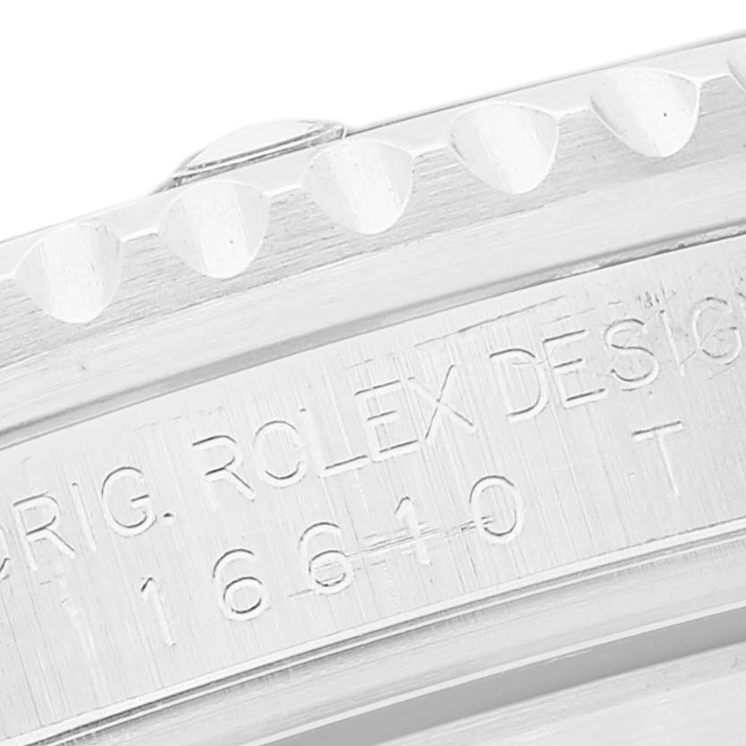 The image shows a close-up of the bezel and engraved model number (16610) on a Rolex Submariner 16610 Men
s Stainless Steel Black Dial 16610 Men
s Stainless Steel Black Dial watch.
