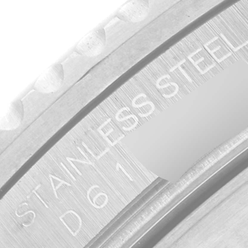 This image shows a close-up of the stainless steel inner bezel and serial number on a Rolex Submariner 16610 Men's Stainless Steel Black Dial 16610 Men's Stainless Steel Black Dial watch.