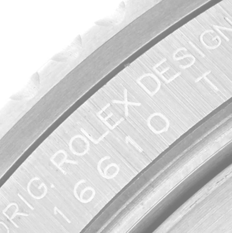This close-up image shows the engraved side detail of a Rolex Submariner 16610 Men's Stainless Steel Black Dial 16610 Men's Stainless Steel Black Dial watch.