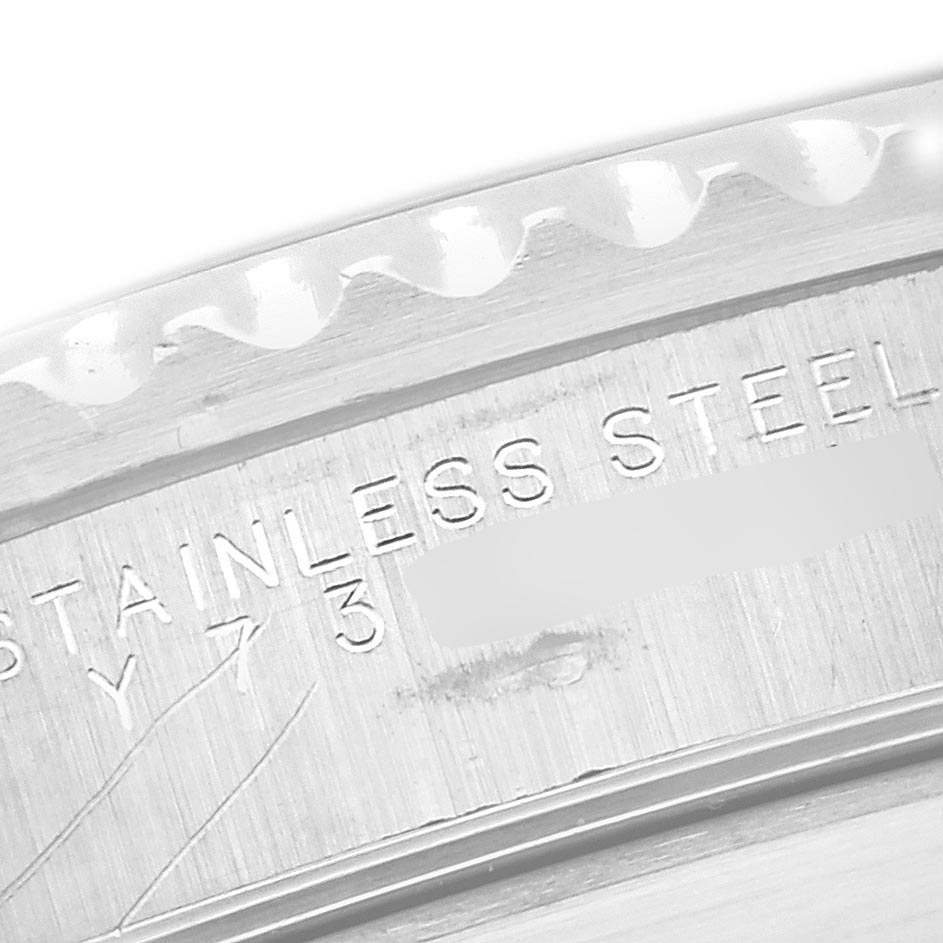 The image shows a close-up of the engraved stainless steel case back of a Rolex Submariner 14060 Men
s Stainless Steel Black Dial 14060 Men
s Stainless Steel Black Dial watch.