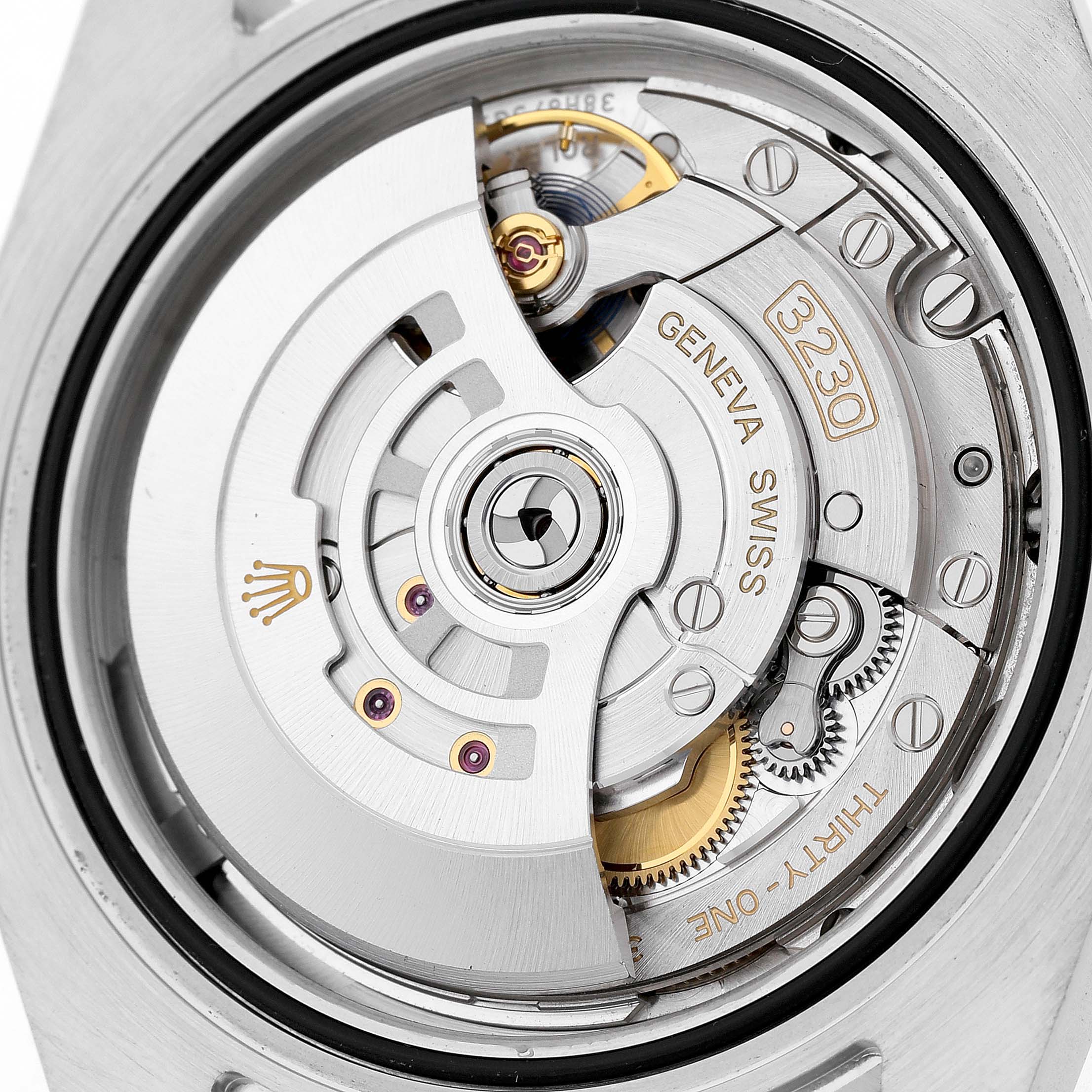 The image shows the open case back of a Rolex Submariner 124060 Men's Stainless Steel Black Dial, highlighting its intricate mechanical movement components.