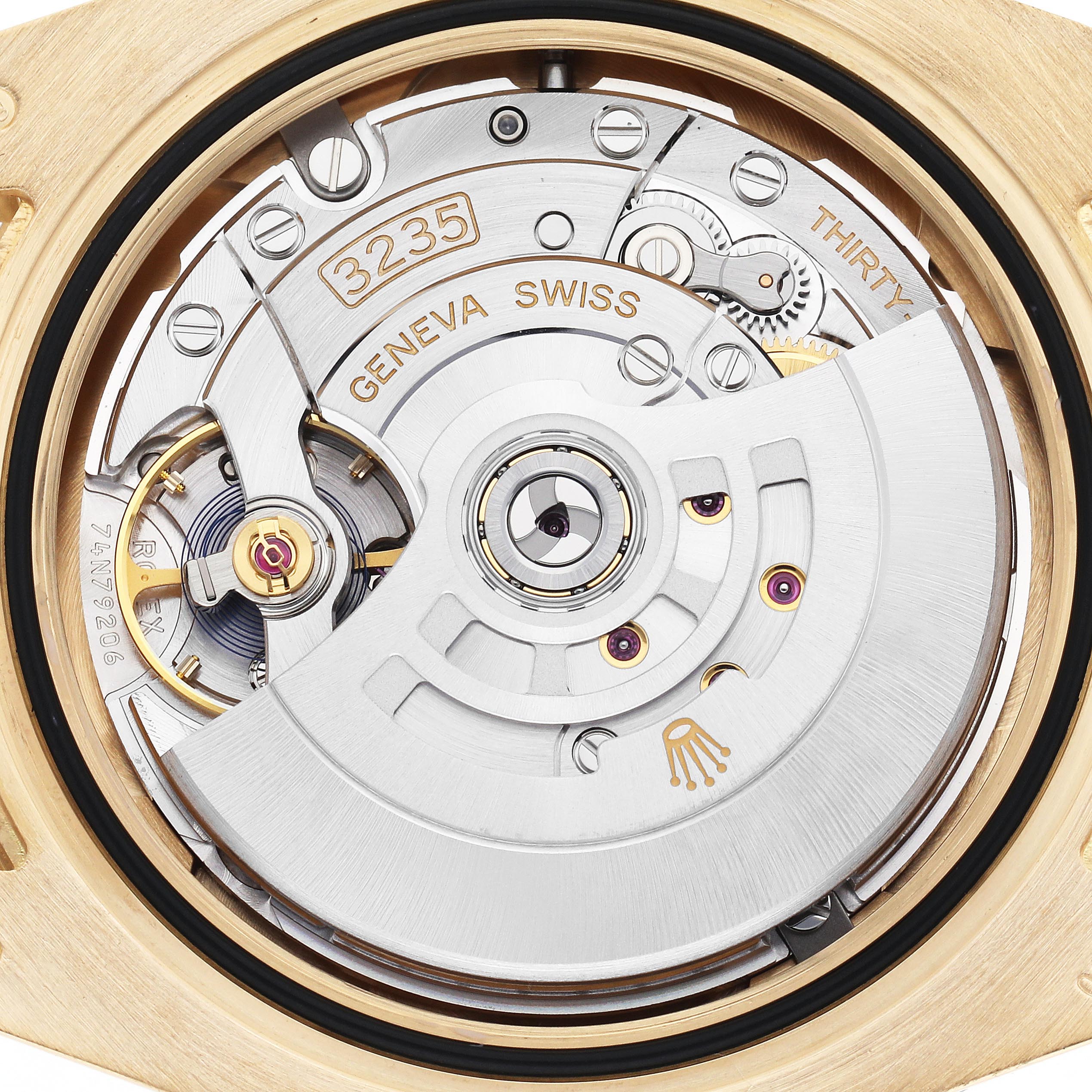 The image shows the detailed movement of a Rolex Submariner 126618 Men
s Yellow Gold Black Dial 126618 Men
s Yellow Gold Black Dial watch from the back, highlighting its inner mechanics and rotor.
