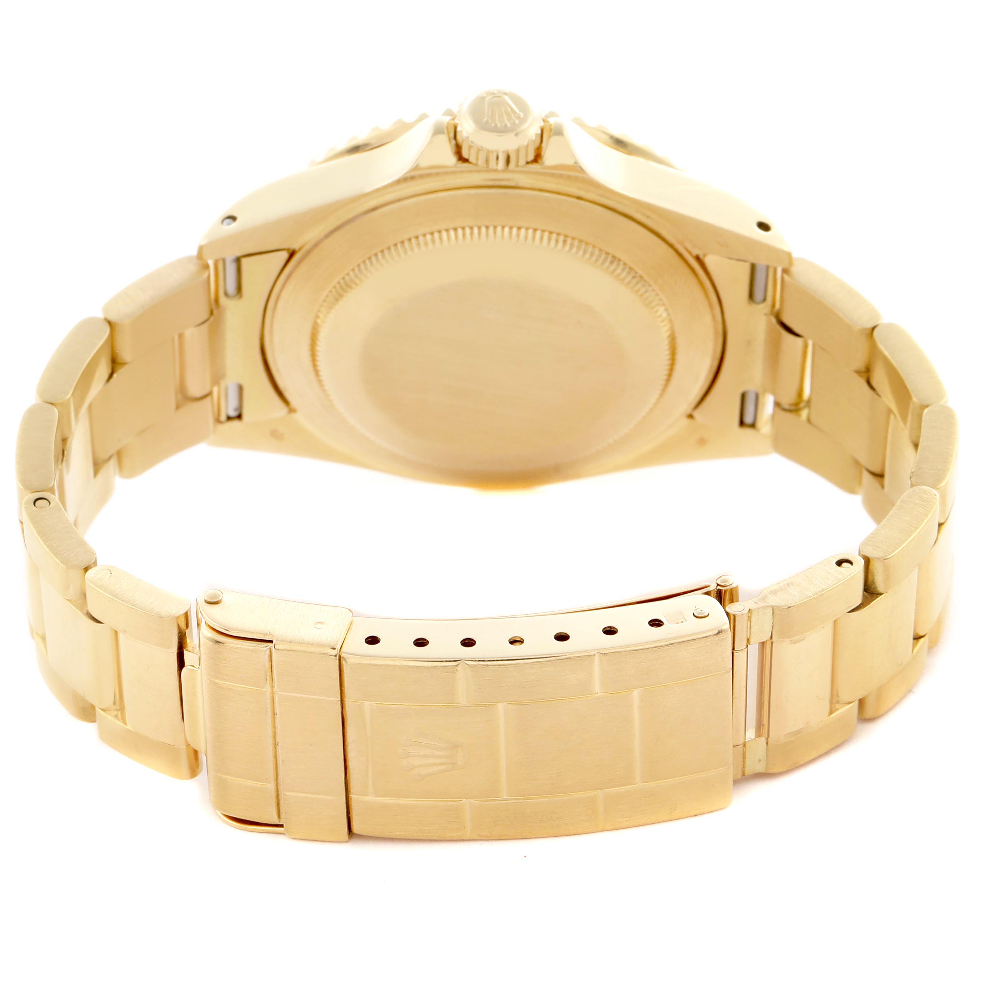 The image shows the back of a Rolex Submariner 16618 Men's Yellow Gold Champagne Dial 16618 Men's Yellow Gold Champagne Dial, highlighting the case back, crown, and gold bracelet with clasp.