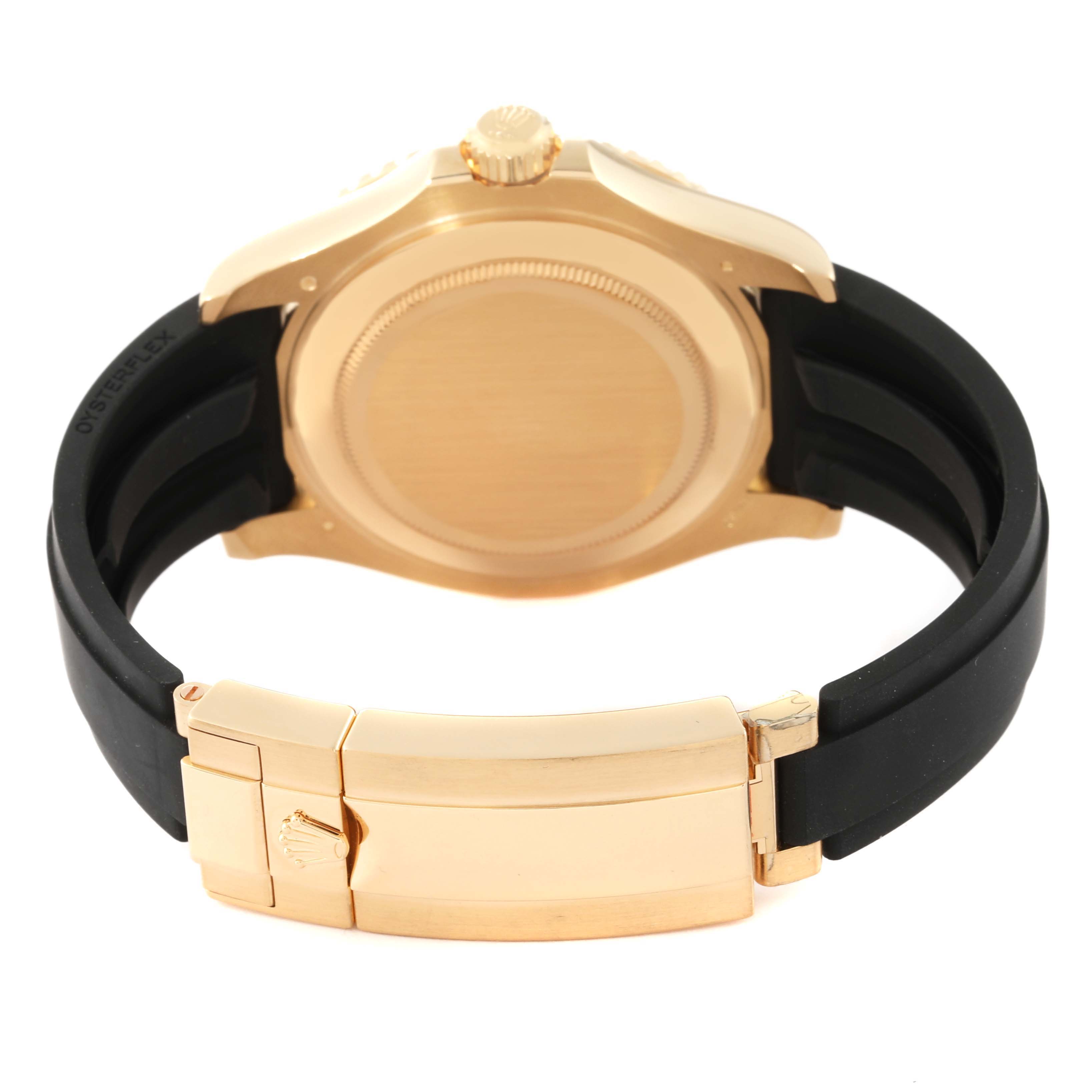 This image shows the back and clasp of a Rolex Yacht-Master 226658 Men's Yellow Gold Black Dial 226658 Men's Yellow Gold Black Dial watch, highlighting its gold case and black strap.
