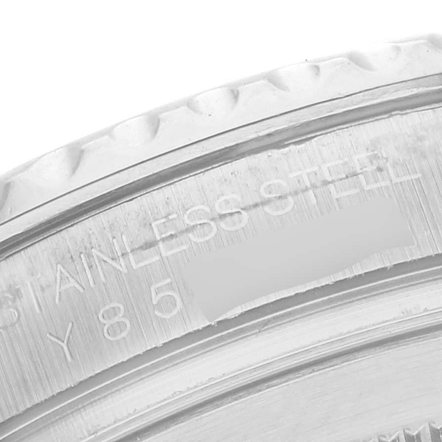 The image shows a close-up of the engraved bezel and edge of the case back of a Rolex Yacht-Master 16622 Men
s Stainless Steel Silver Dial 16622 Men
s Stainless Steel Silver Dial watch.