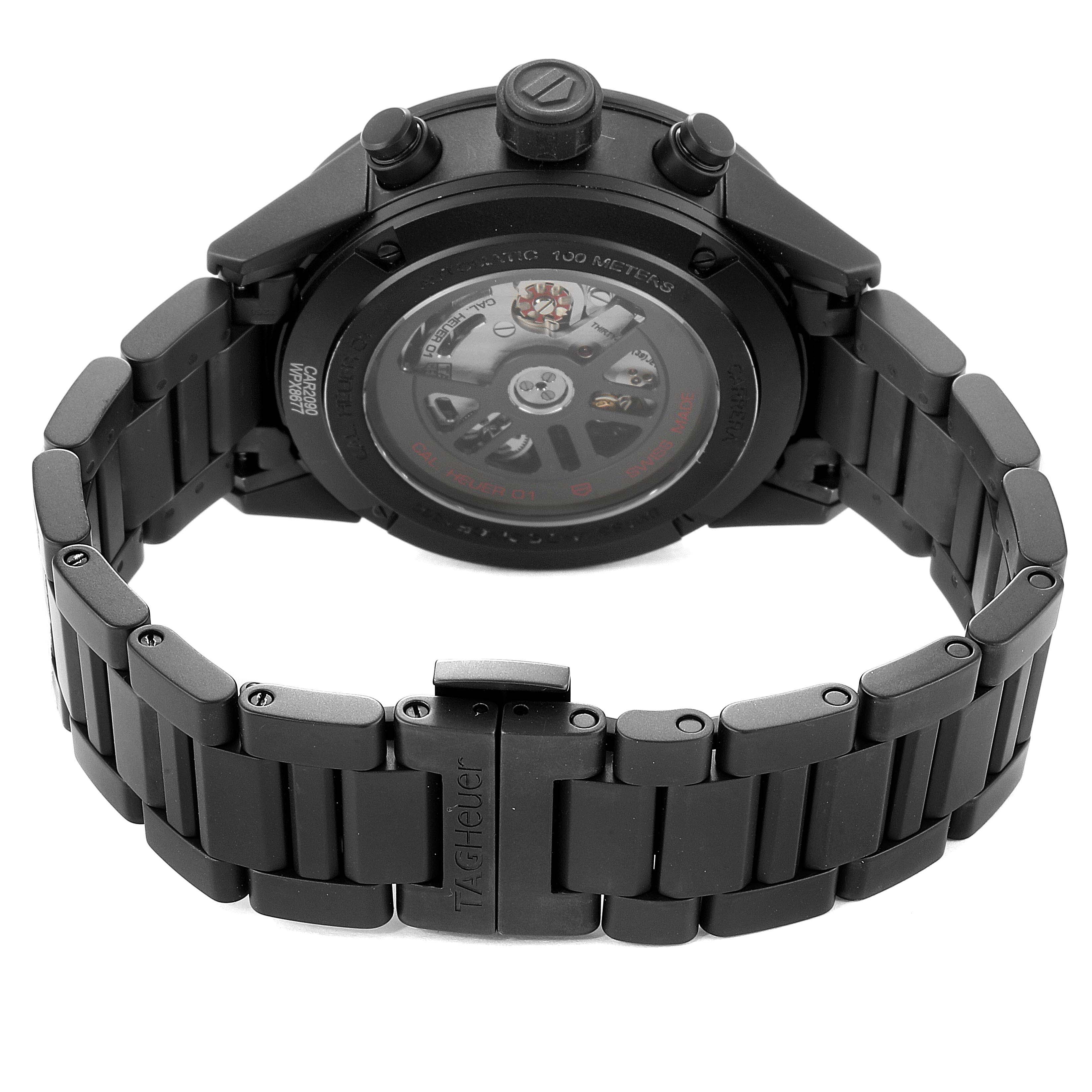 The image shows the back of a Tag Heuer Carrera CAR2090.BH0729 Men
s Titanium Black Dial CAR2090.BH0729 Men
s Titanium Black Dial watch, highlighting its movement and black metal bracelet.